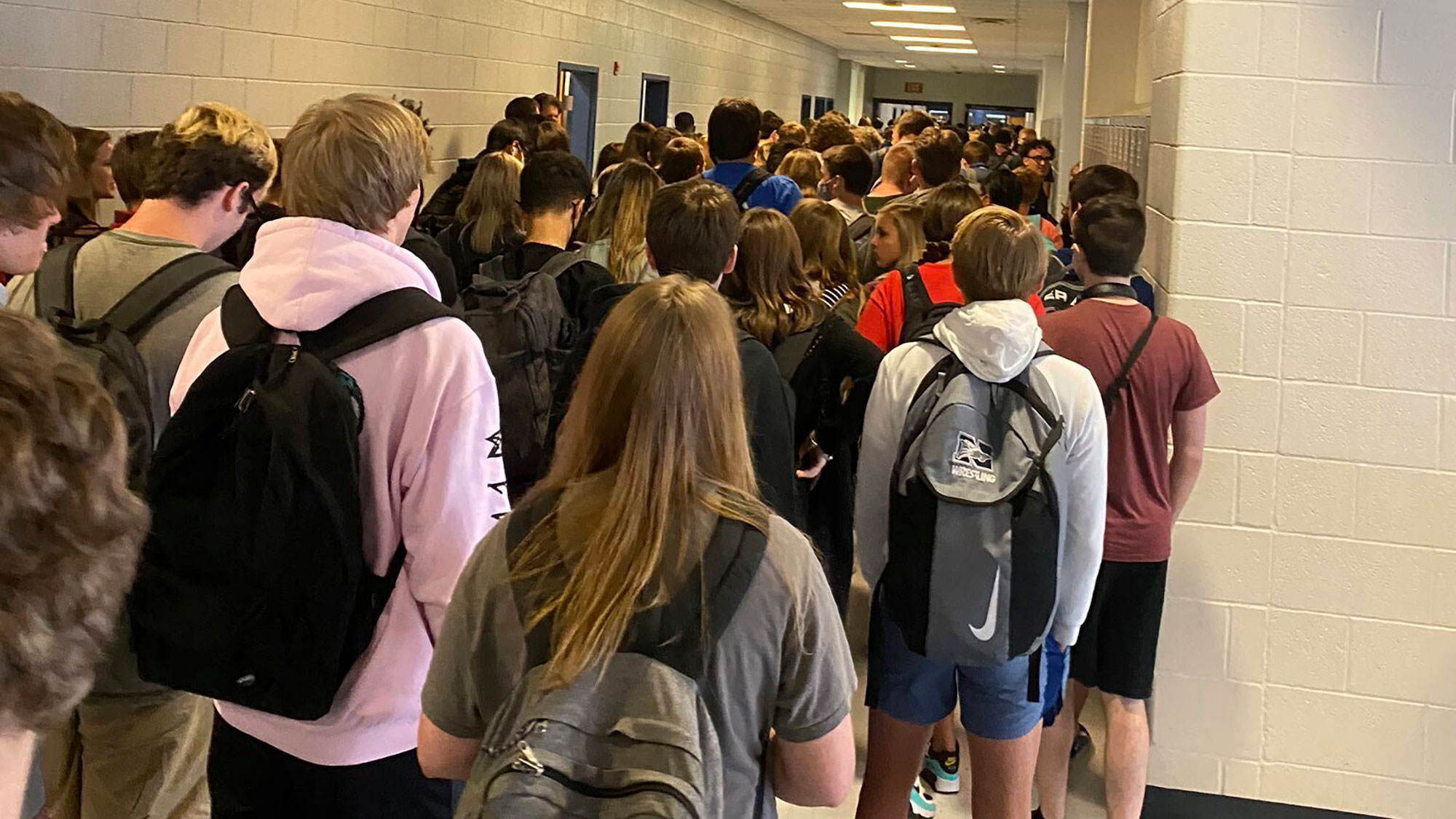 In this photo posted on Twitter by Hannah Watters, students crowd a hallway at North Paulding High School on August 4.