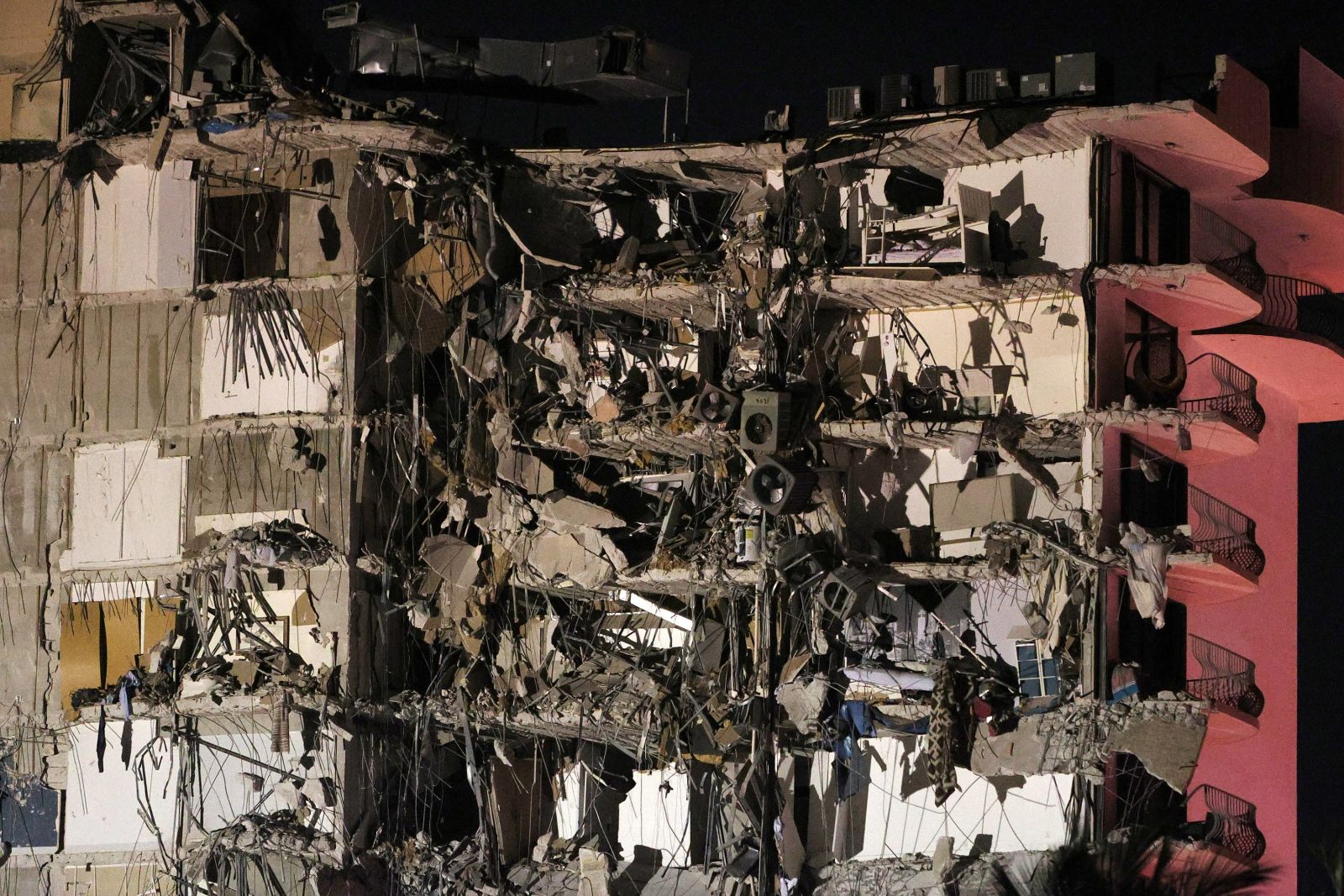 A portion of the multistory building crumbled to the ground.