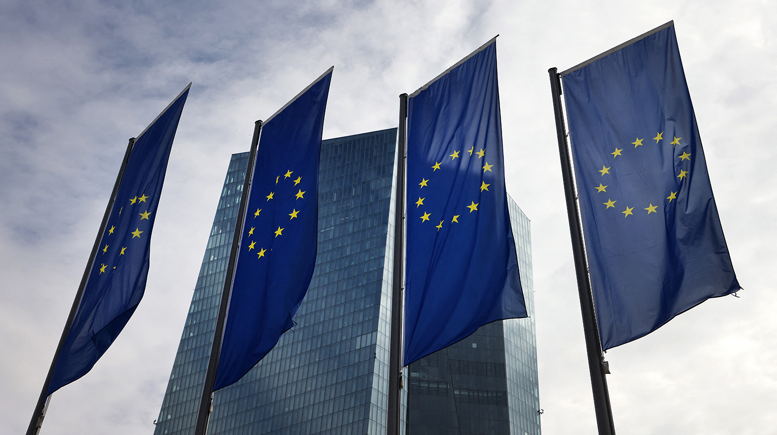 The European Central Bank is pictured behind EU flags in Frankfurt am Main, western Germany, on March 16.