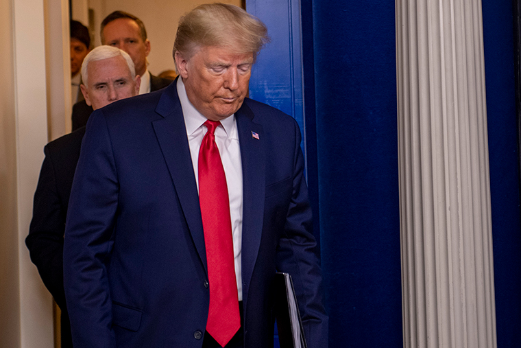 US President Donald Trump arrives to deliver the daily briefing on the novel coronavirus at the White House on  Sunday, March 22. 