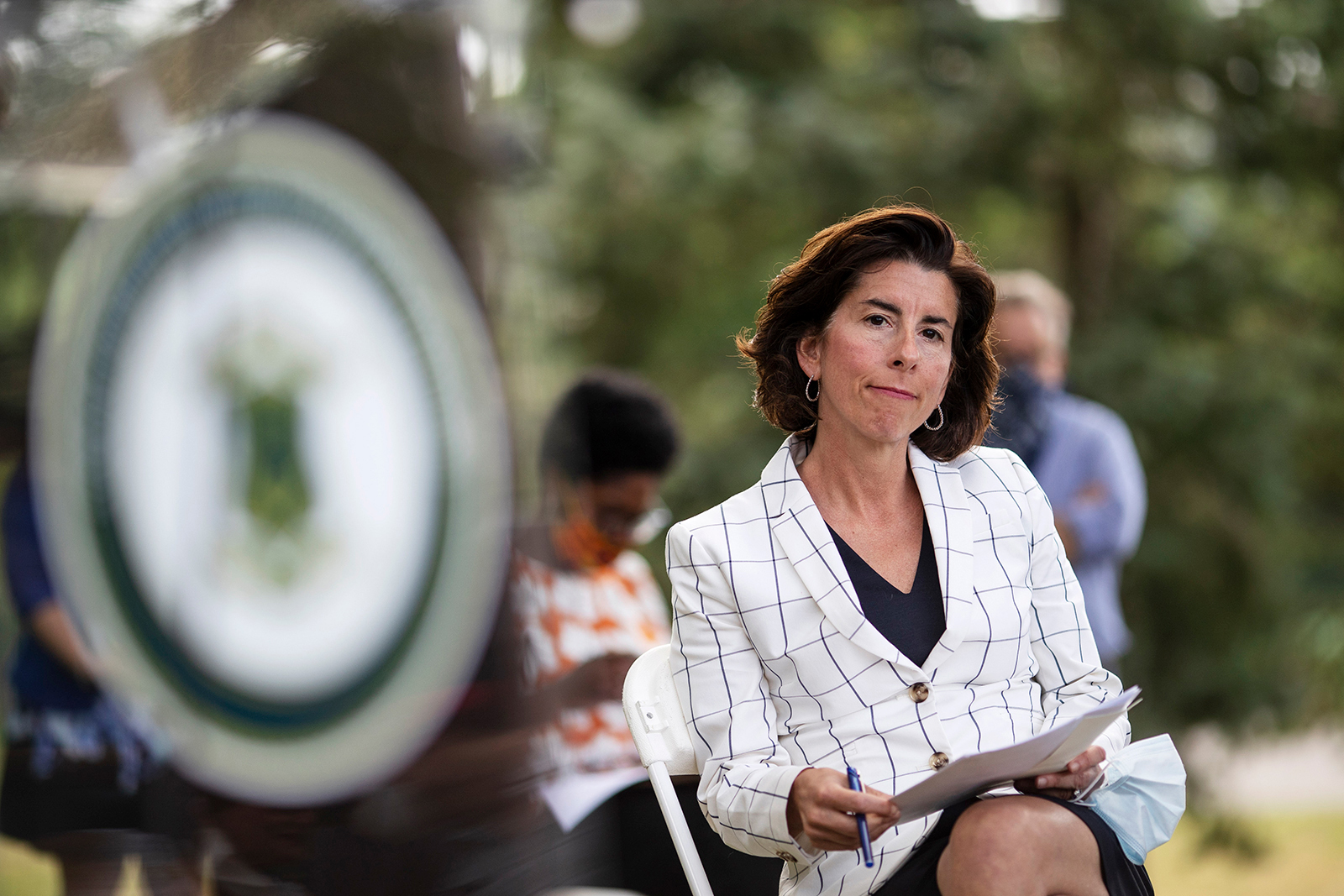 Rhode Island Gov. Gina Raimondo sits during a news conference Monday, June 22, in Providence, Rhode Island.