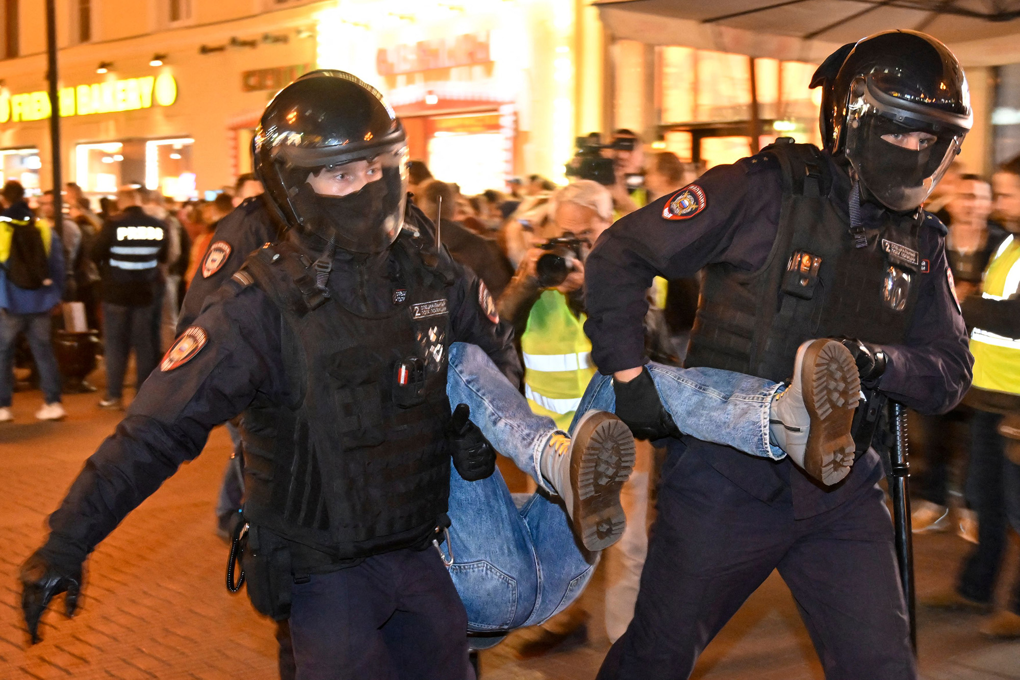Police officers detain a person in Moscow on Wednesday, September 21. 