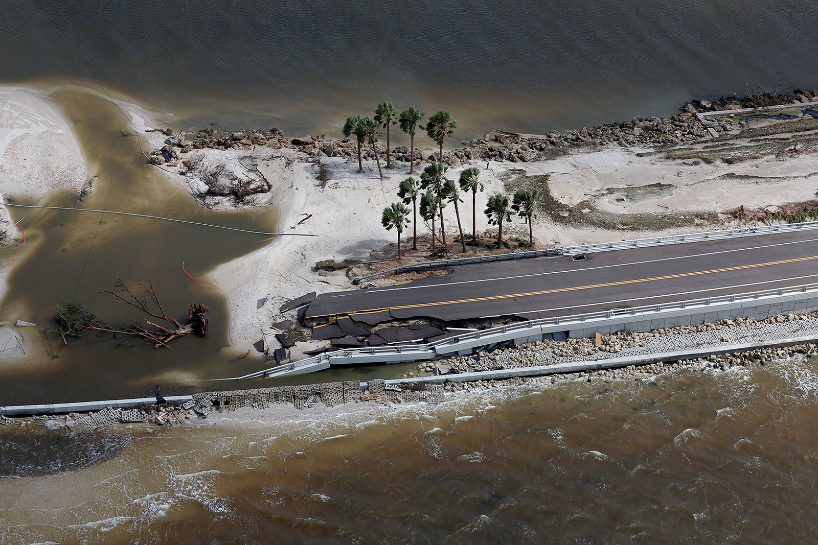 In this aerial view, parts of Sanibel Causeway are washed away along with sections of the bridge. 