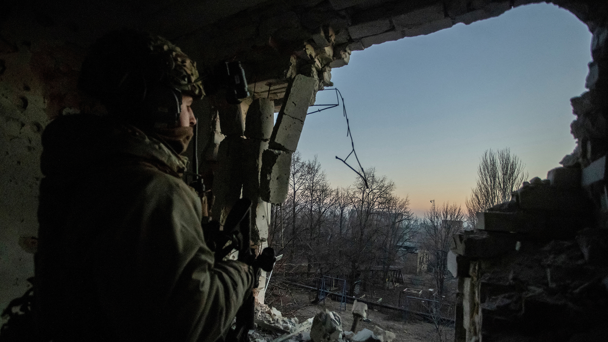 A Ukrainian serviceman looks out into Bakhmut amid Russia's attack on January 27.
