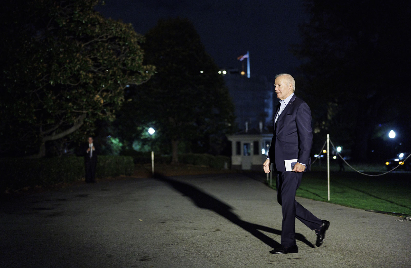 President Joe Biden walks on the south lawn of the White House on November 6. 