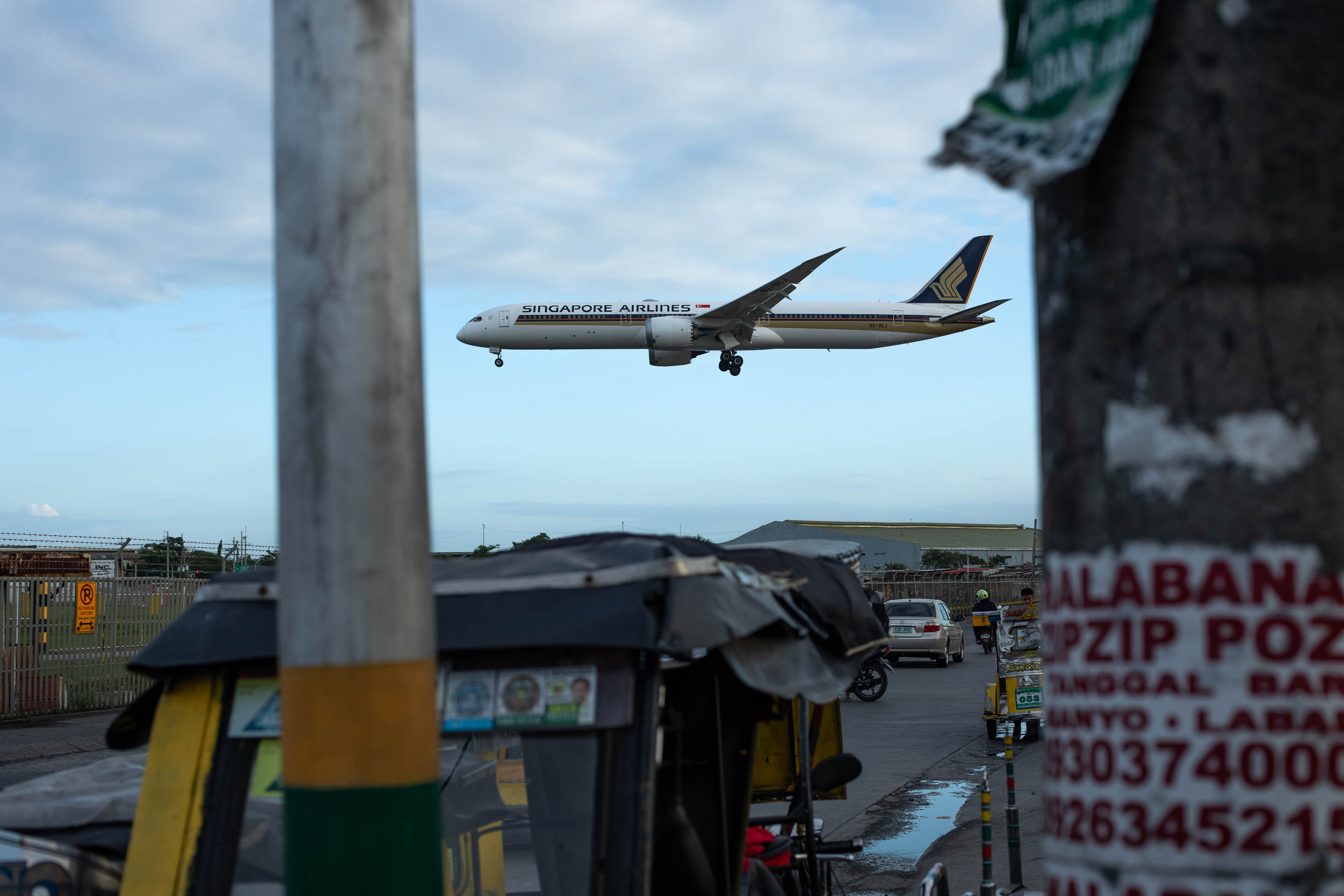 A Singapore Airlines plane prepares to land at Ninoy Aquino International Airport in Manila, Philippines, on February 13.
