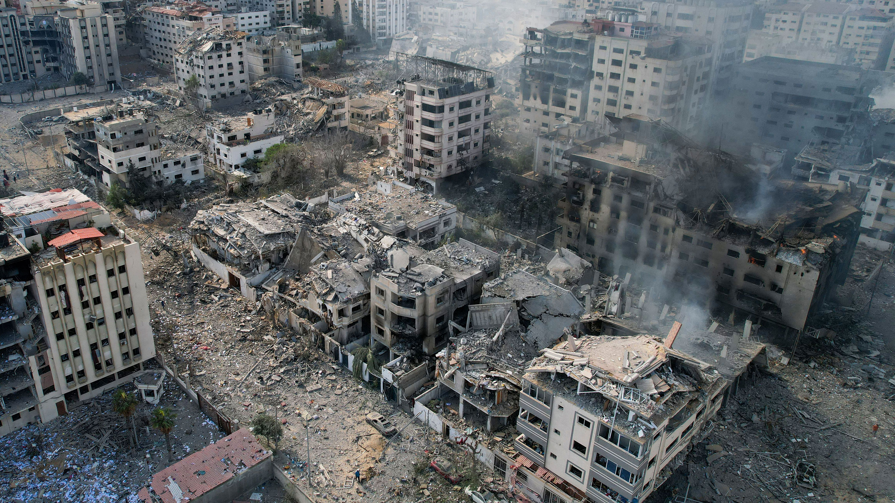 This aerial photo shows heavily damaged buildings following Israeli airstrikes in Gaza City on October 10, 2023.