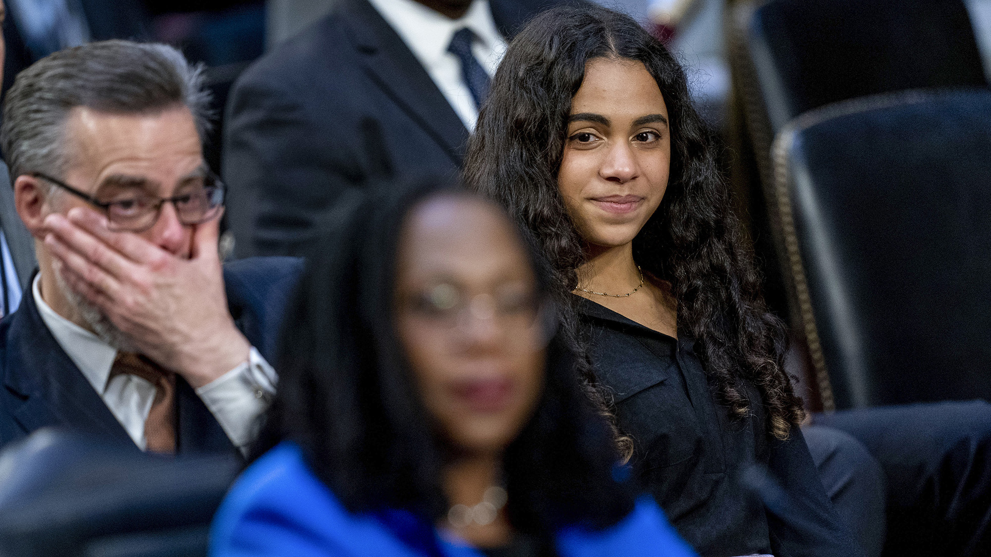 Leila Jackson, right, watches as her parents Dr. Patrick Jackson, left, and Supreme Court nominee Ketanji Brown Jackson, foreground, become emotional during a back and forth with Sen. Alex Padilla on Wednesday, March 23.
