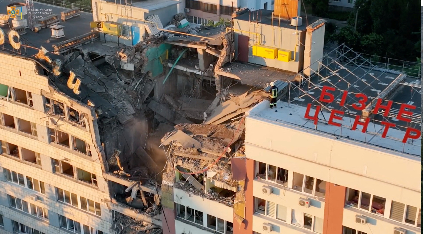 A firefighter works at the site of a building damaged by a Russian military strike in Mykolaiv, Ukraine, on July 14.