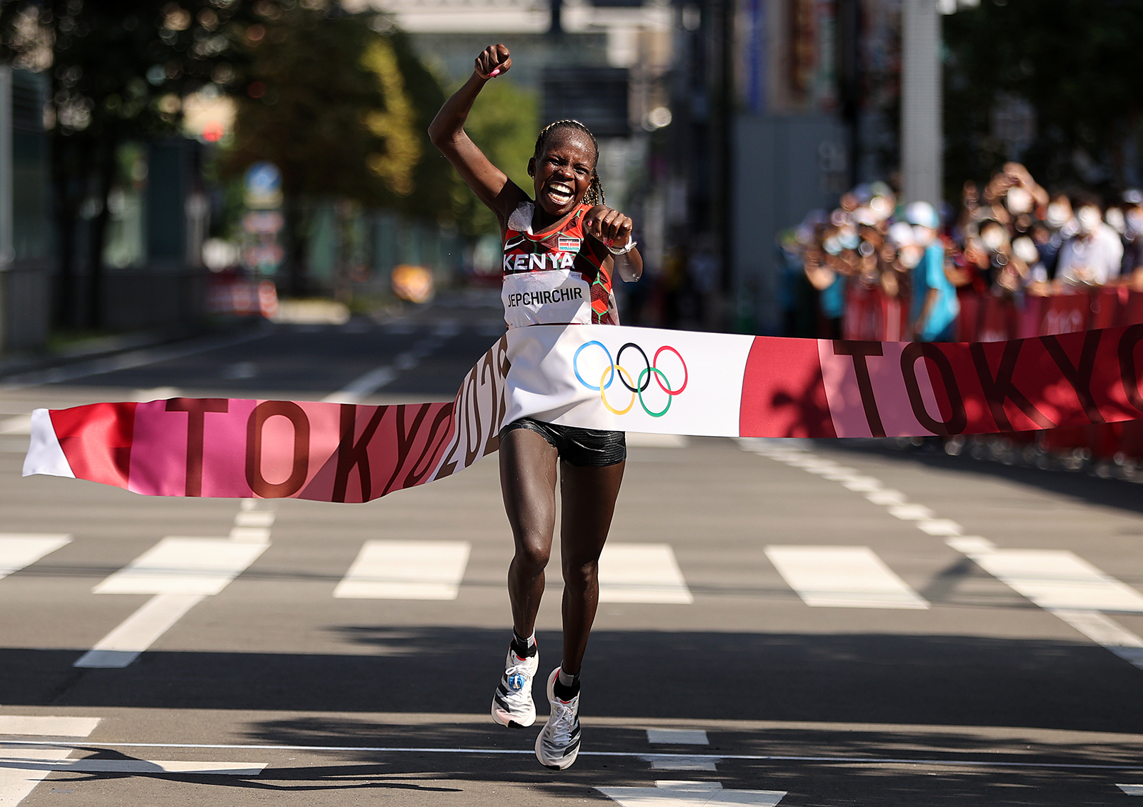 Kenya's Peres Jepchirchir celebrates as she crosses the finish line to win the gold medal in the marathon final on August 7.