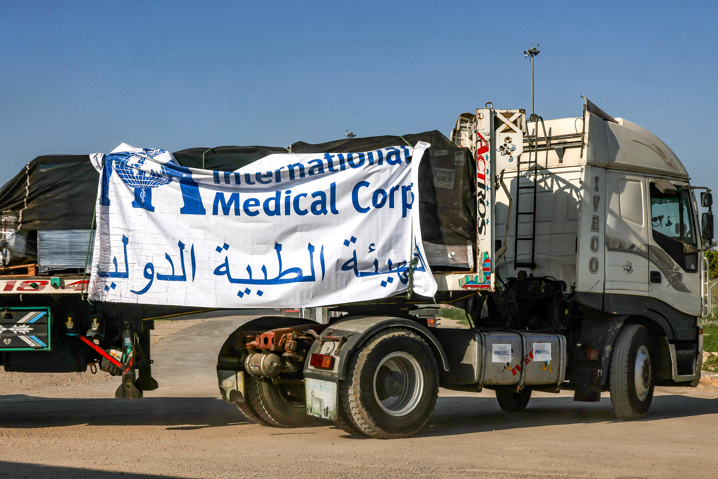A truck carrying humanitarian aid provided by the International Medical Corps moves at the Israeli side of the Kerem Shalom border crossing with the southern Gaza Strip on December 19.