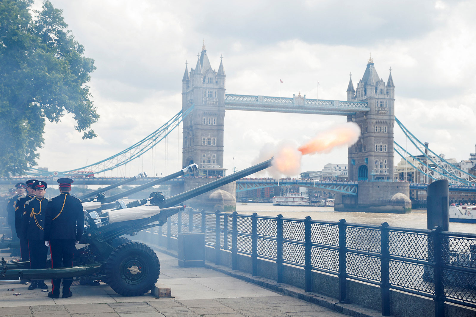 Members of the Honourable Artillery Company perform a gun salute at the Tower of London.