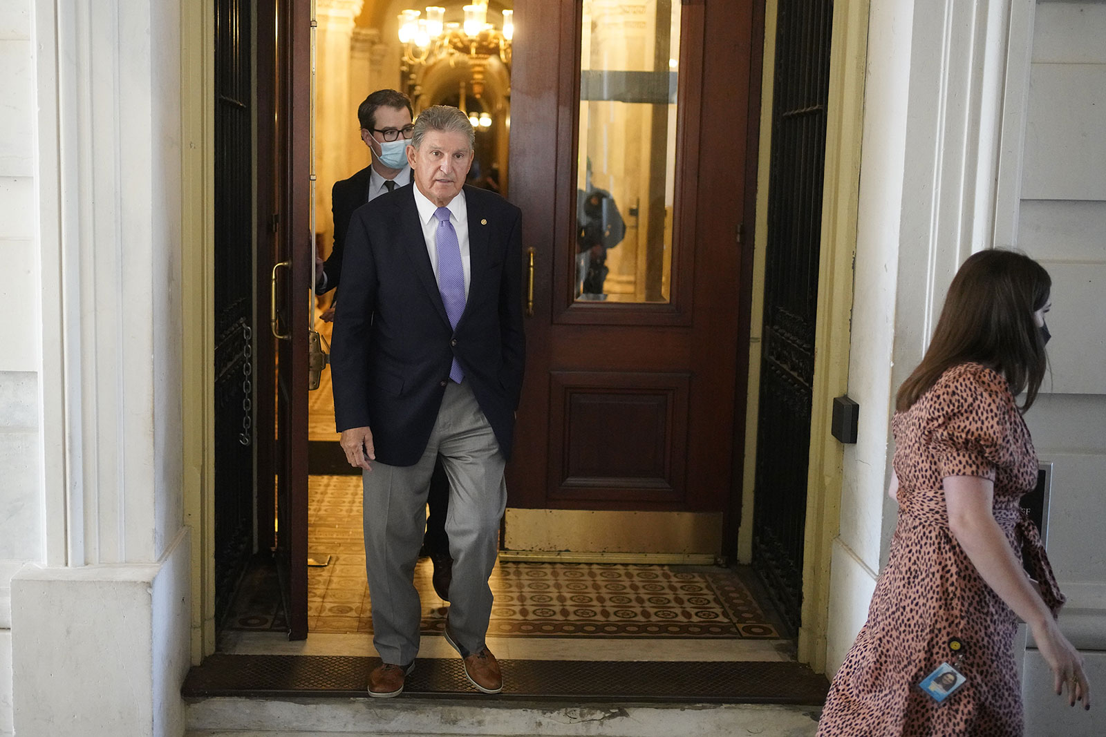 Sen. Joe Manchin walks out of the US Capitol on Thursday.
