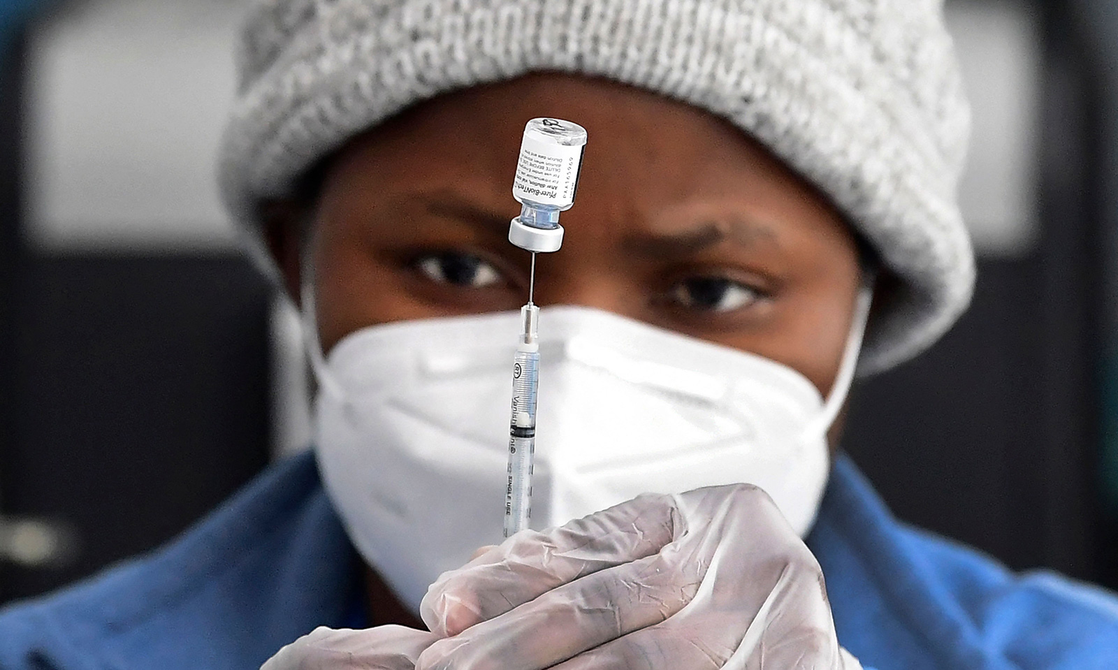 A nurse prepares the Pfizer Covid-19 vaccine a public housing project pop-up site targeting vulnerable communities in Los Angeles, California on March 10. 
