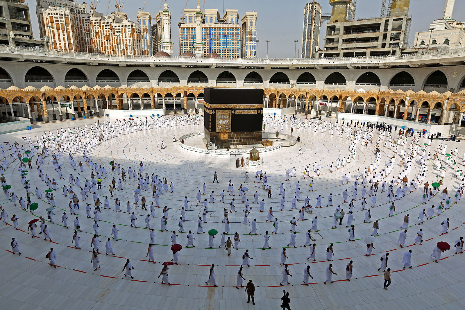 Muslim pilgrims maintain social distancing as they circle the Kaaba in the Islamic holy city of Mecca in Saudi Arabia on Friday, July 31.