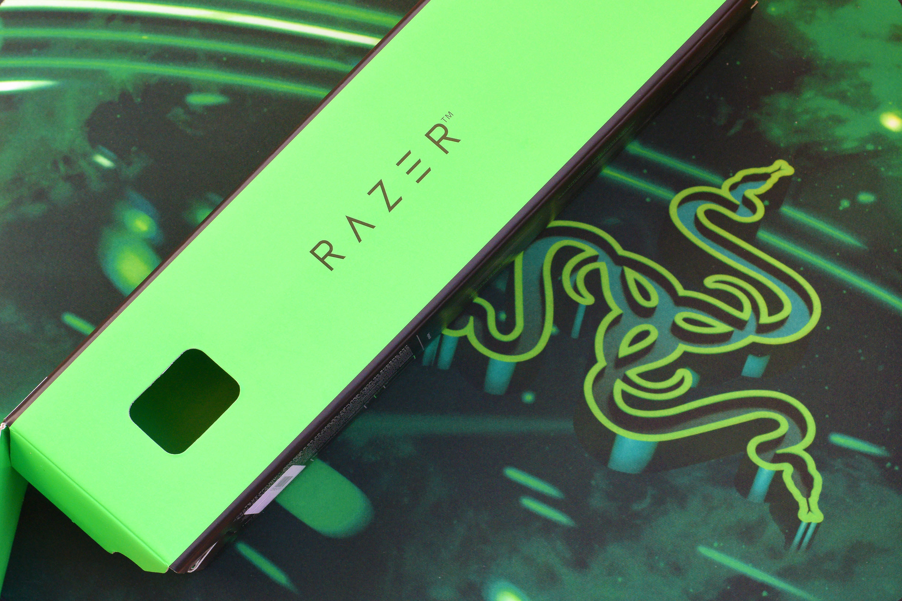 A Razer Goliathus Speed Gaming green mouse pad and box. 