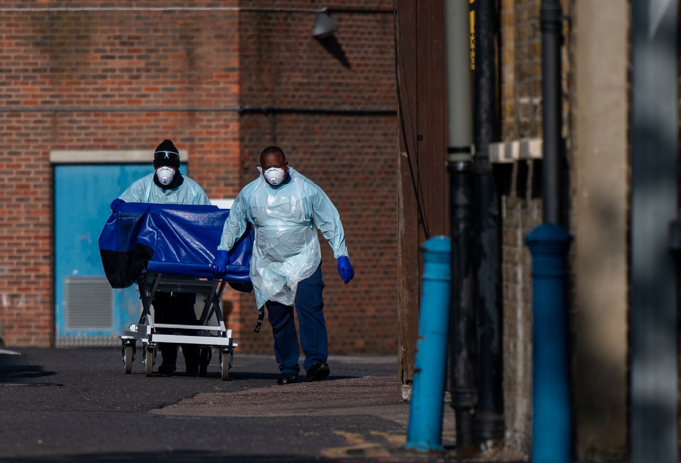 Hospital workers wheel a stretcher to the mortuary at Lewisham Hospital in London  on April 16.