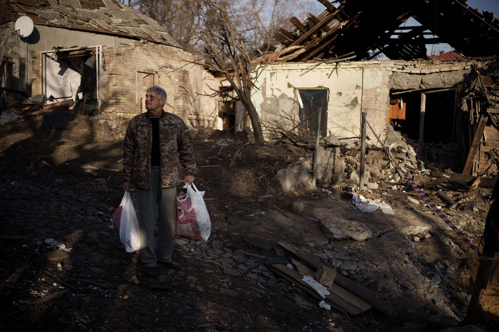 Anatolii Kaharlytskyi, 73, stands near his house, heavily damaged after a Russian attack in Kyiv, Ukraine, on Monday, January 2.
