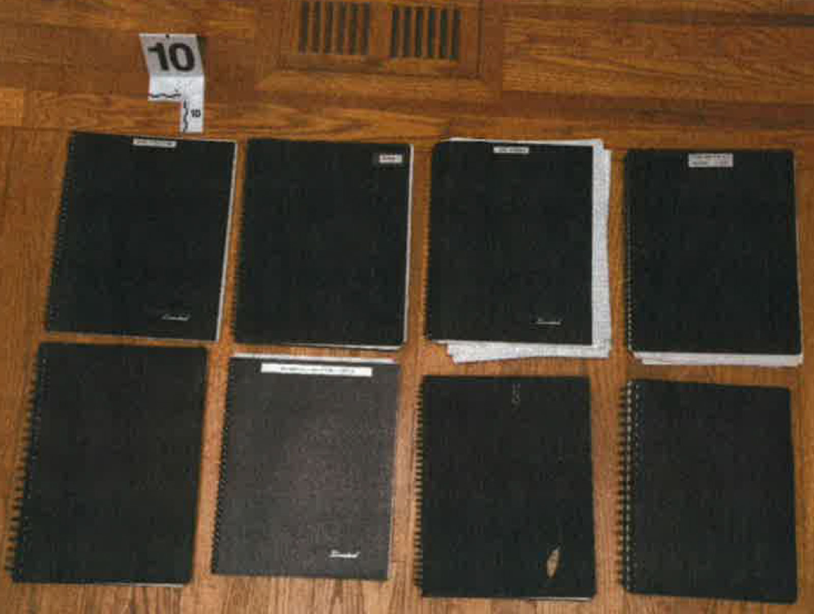 From page 80, notebooks seized from a file cabinet under a television in Delaware home office.