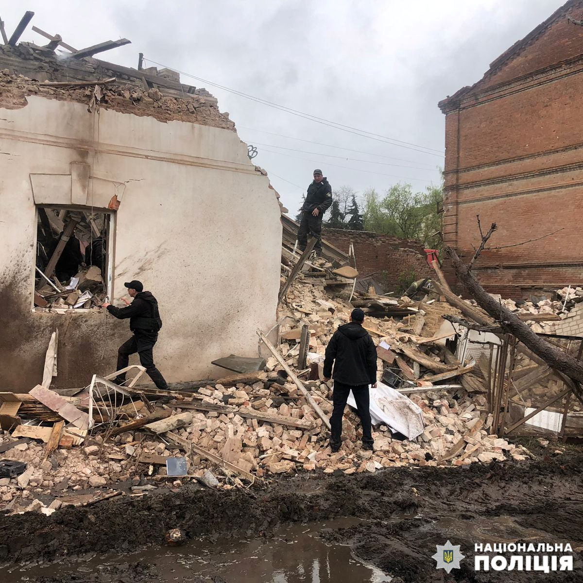 Police officers work at a site of a local museum heavily damaged by a Russian missile strike in the town of Kupiansk, Kharkiv region, Ukraine, on April 25.