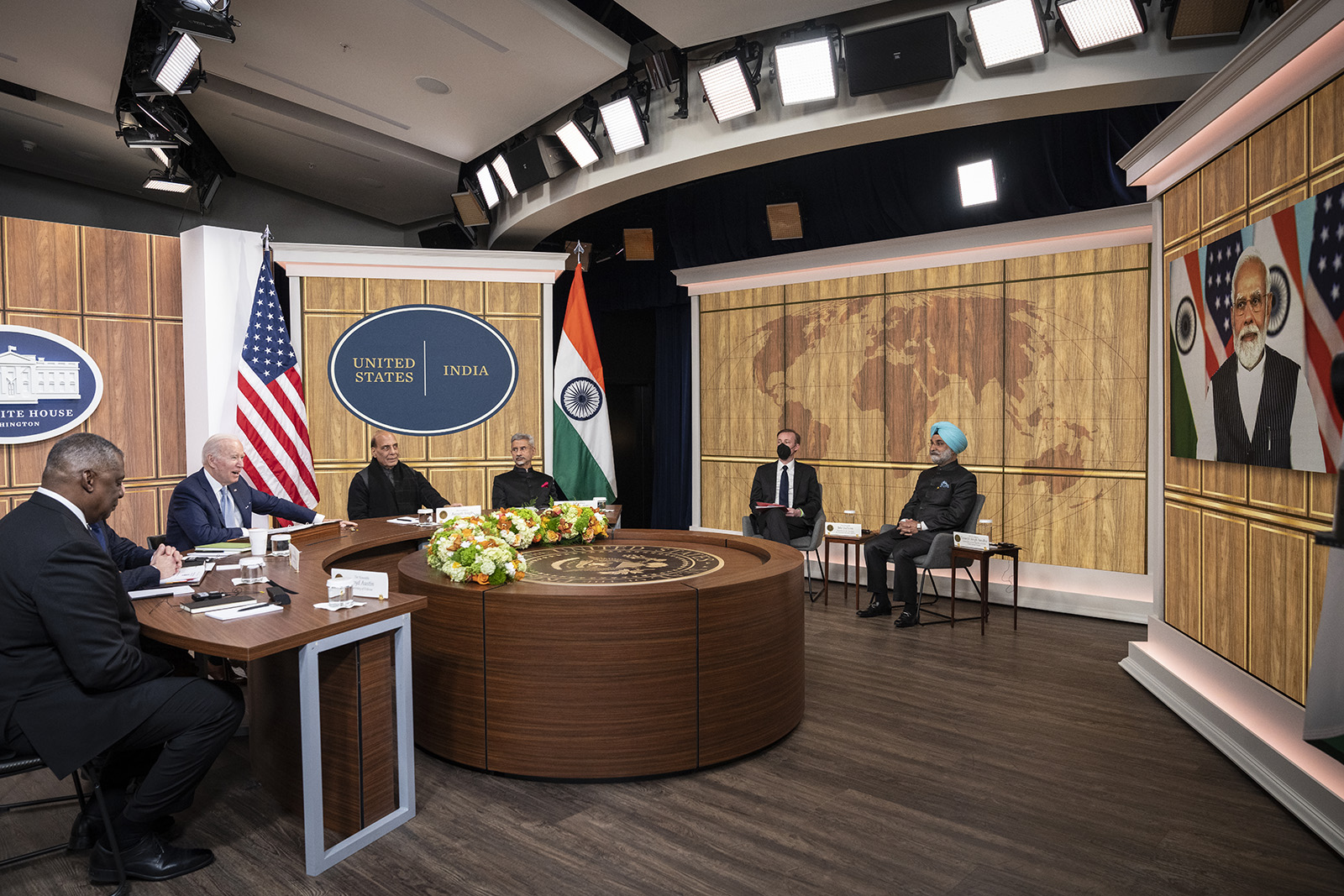 From left: US Defense Secretary Lloyd Austin, US President Joe Biden, Indian Minister of Defense Rajnath Singh, and Indian Foreign Minister Subrahmanyam Jaishankar listen as Prime Minister of India Narendra Modi (on screen) speaks during a virtual meeting at the White House on April 11, in Washington, DC. 