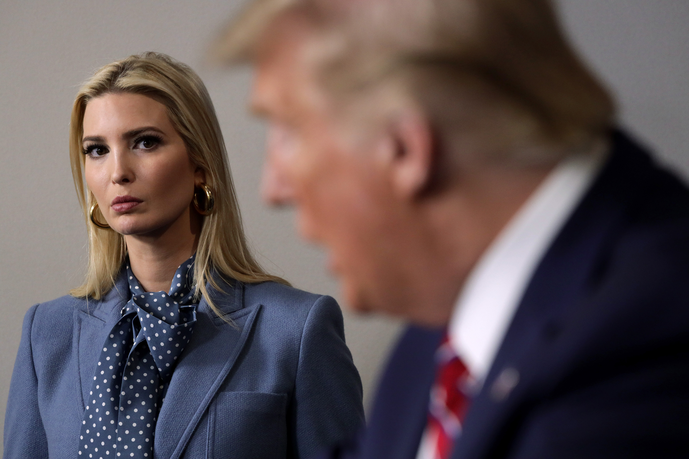 President Donald Trump speaks as his daughter and senior adviser Ivanka Trump looks on during a March 2020 news briefing at the White House.
