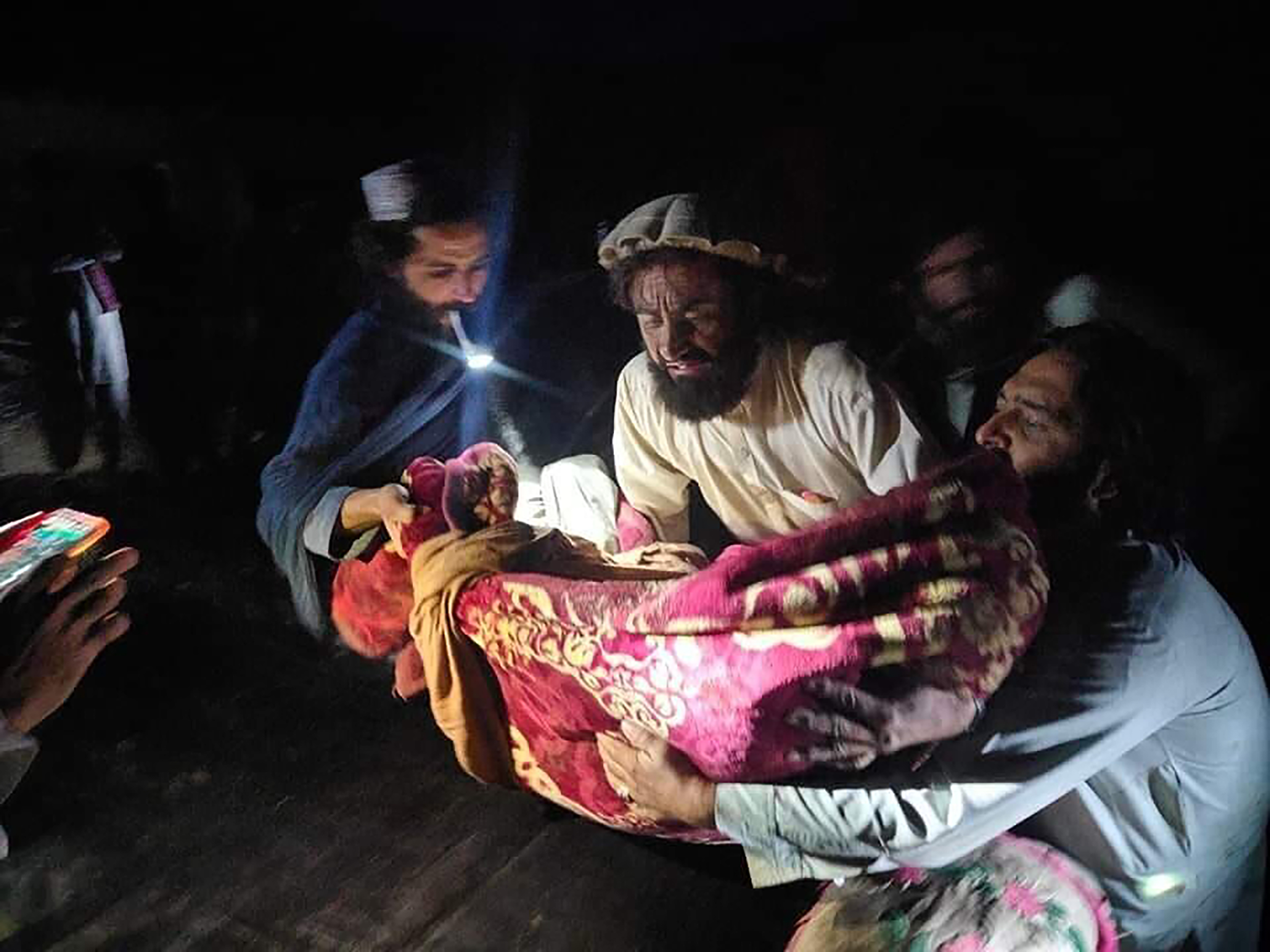 People evacuate wounded in an earthquake in the province of Paktika, eastern Afghanistan, on Wednesday.