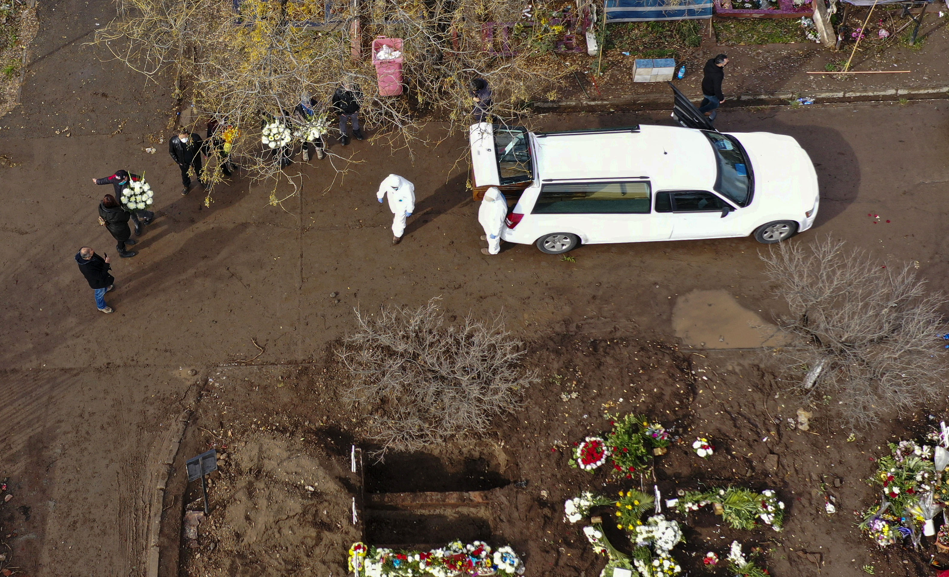 A person said to have died from Covid-19 is brought for burial to the General Cemetery in Santiago, Chile, on June 23.