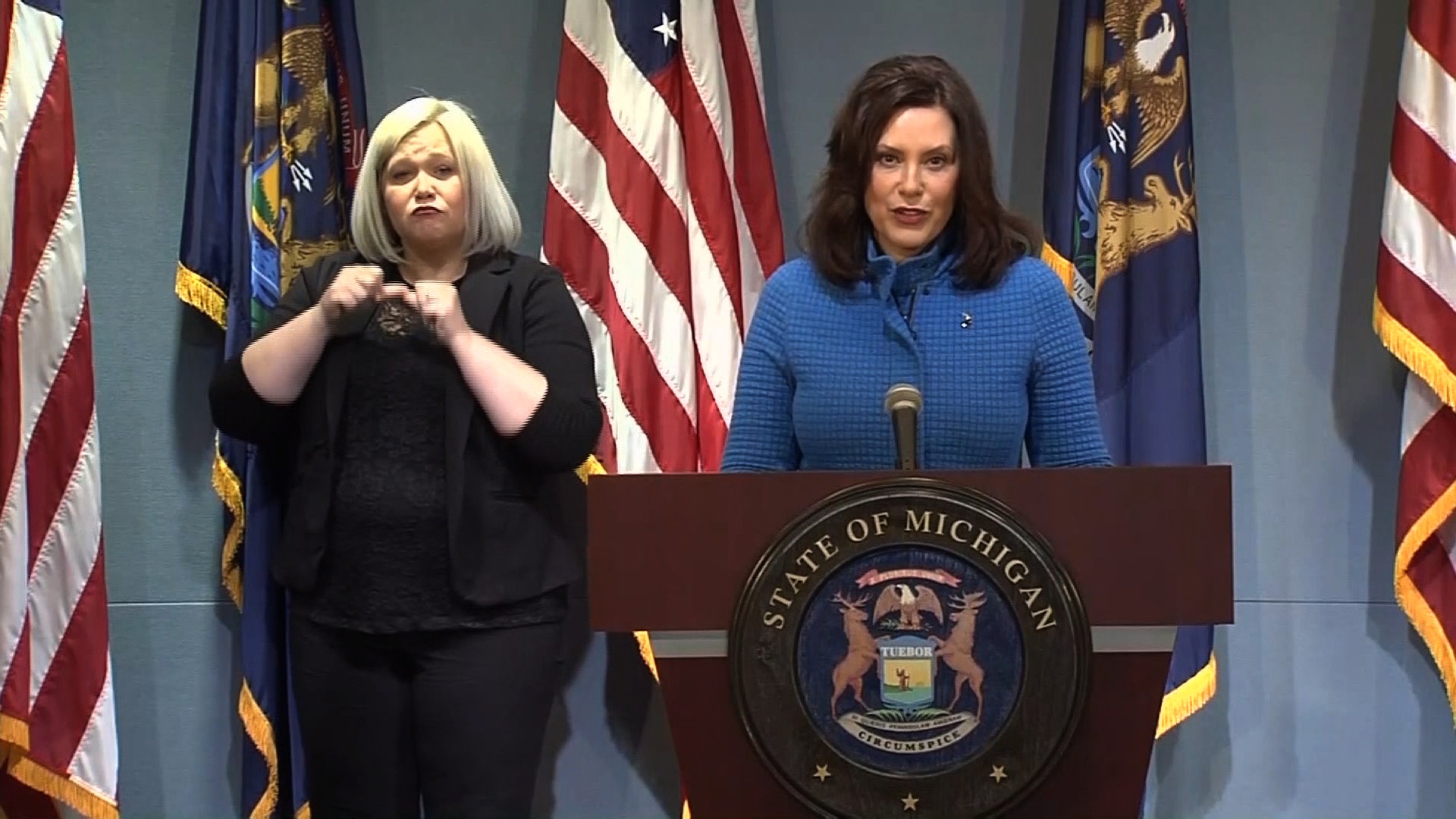 Michigan Gov. Gretchen Whitmer, right, speaks during a press conference in Lansing, Michigan, on May 18.