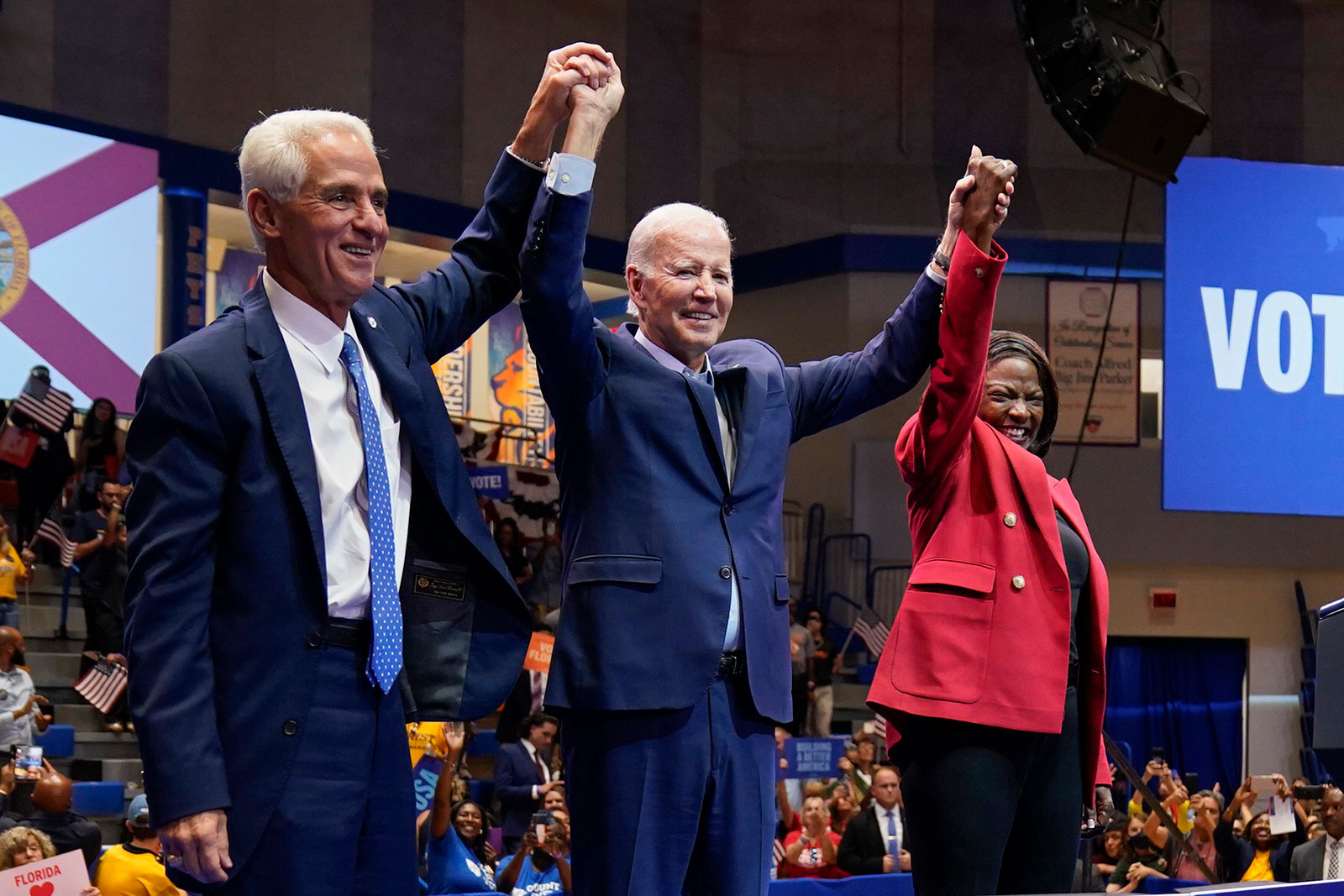 President Joe Biden is joined on stage with Charlie Crist and Val Demings Tuesday evening at a campaign rally in Miami Gardens, Florida. 