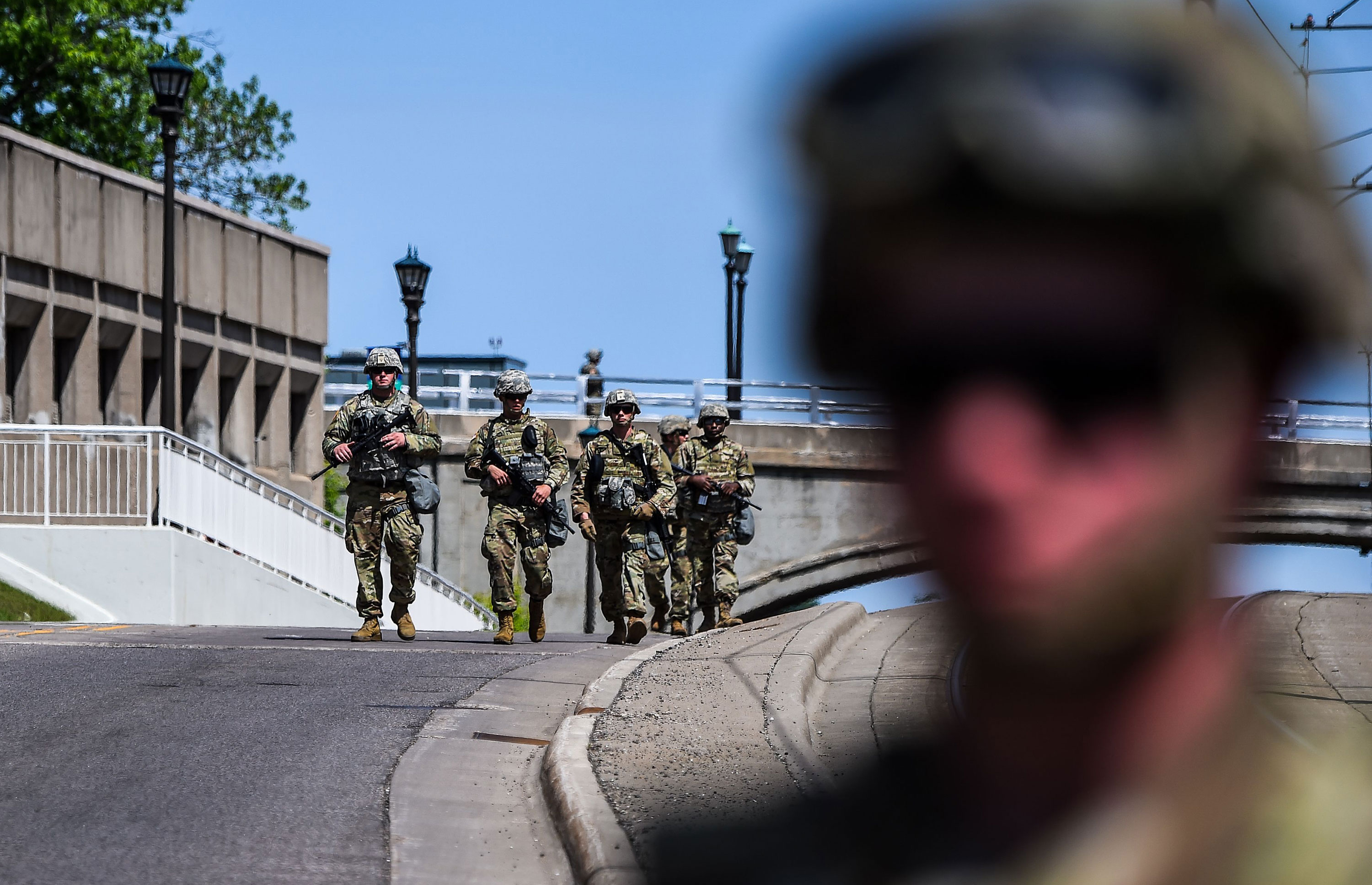Minnesota National Guard soldiers patrol the area outside the State Capitol as hundreds gather to protest on May 31 in St. Paul, Minnesota.