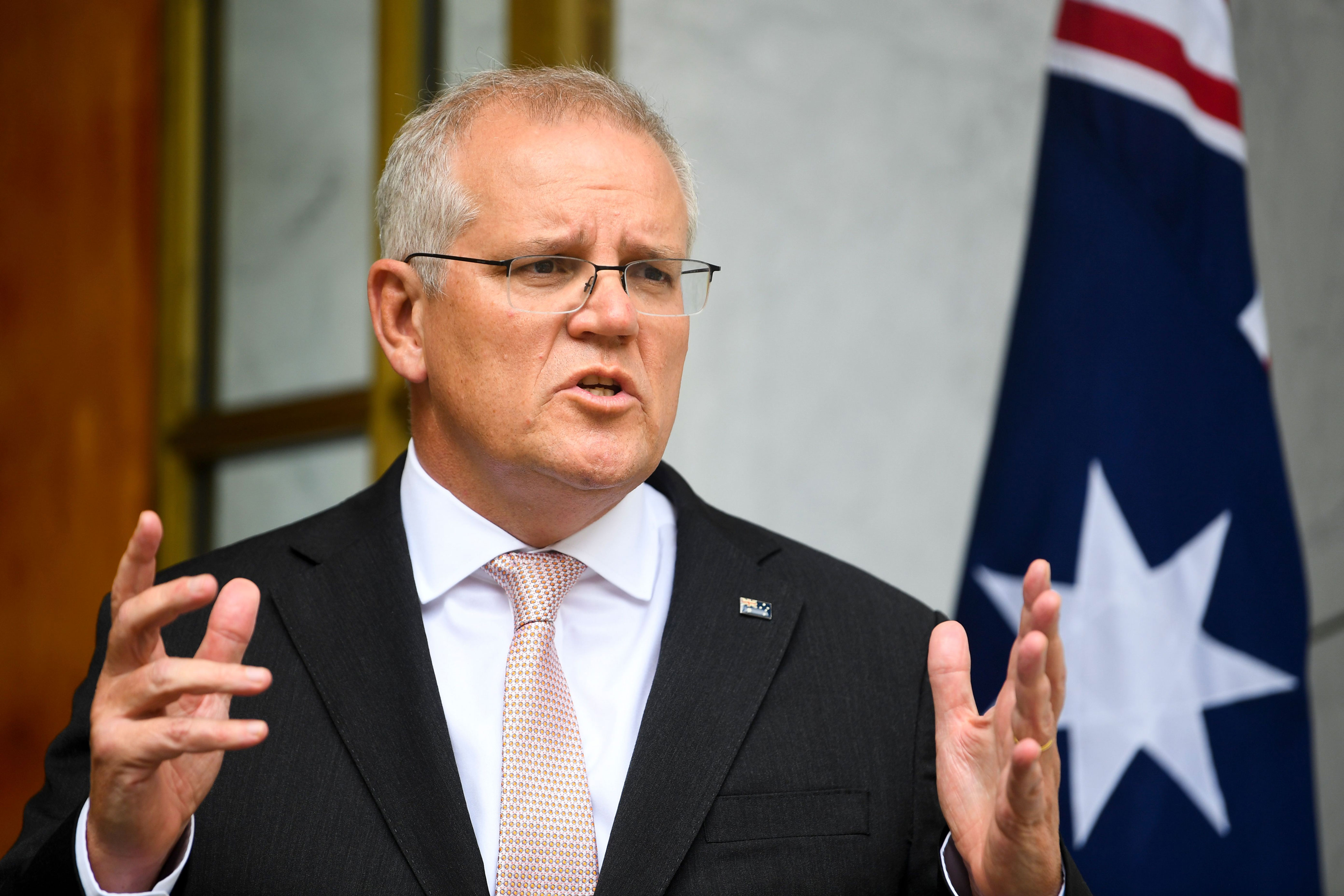 Australian Prime Minister Scott Morrison speaks to the media during a press conference following a national cabinet meeting, at Parliament House in Canberra, Australia, Thursday.