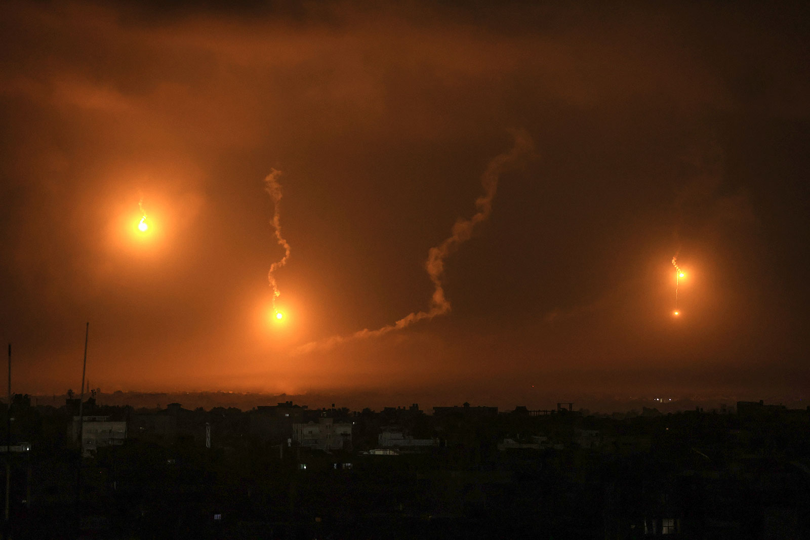 Israeli flares light the sky above Khan Younis in southern Gaza on December 1.