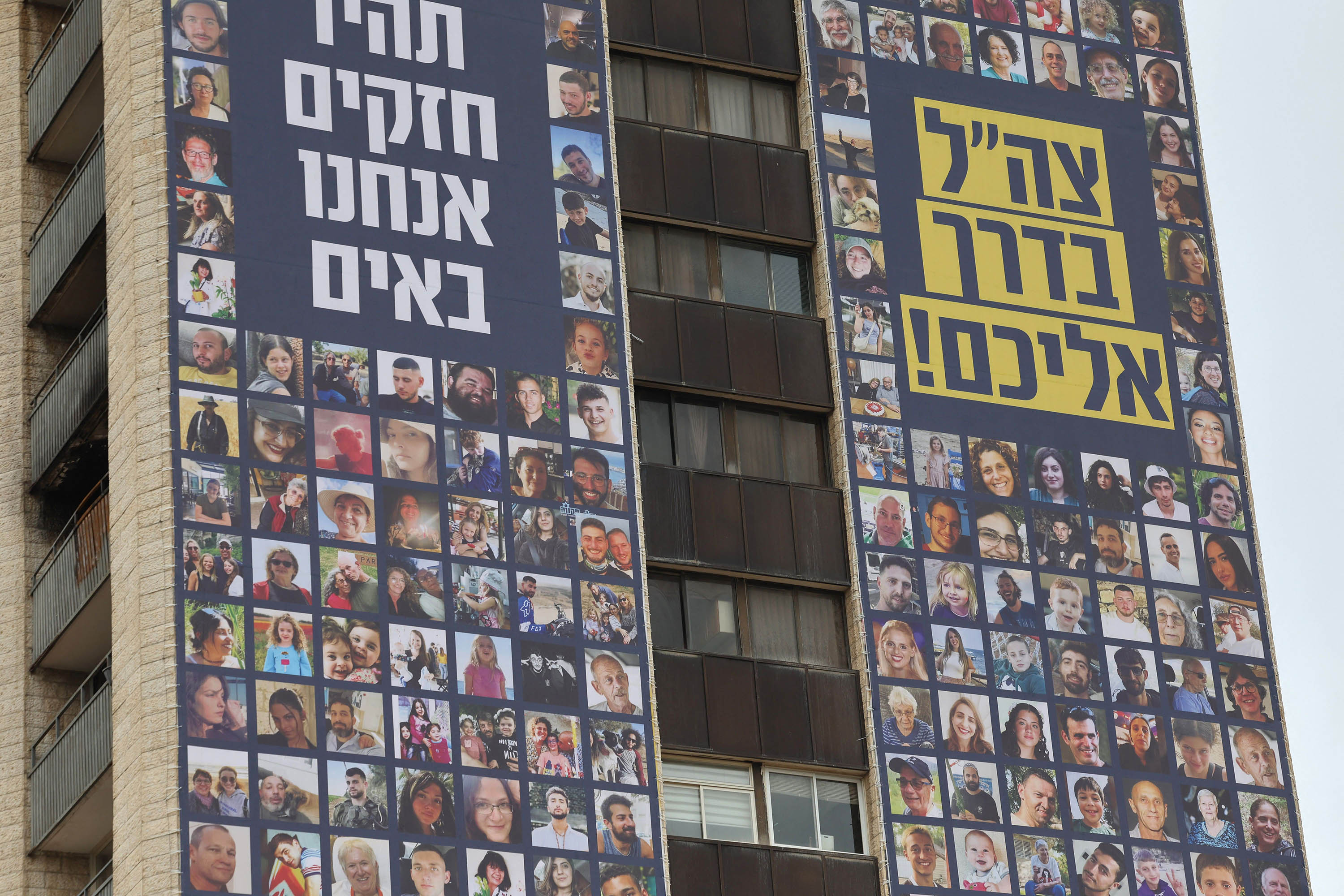 A billboard in Jerusalem displays the portraits of Israeli hostages taken by Hamas militants in the October 7 attack, on November 22.