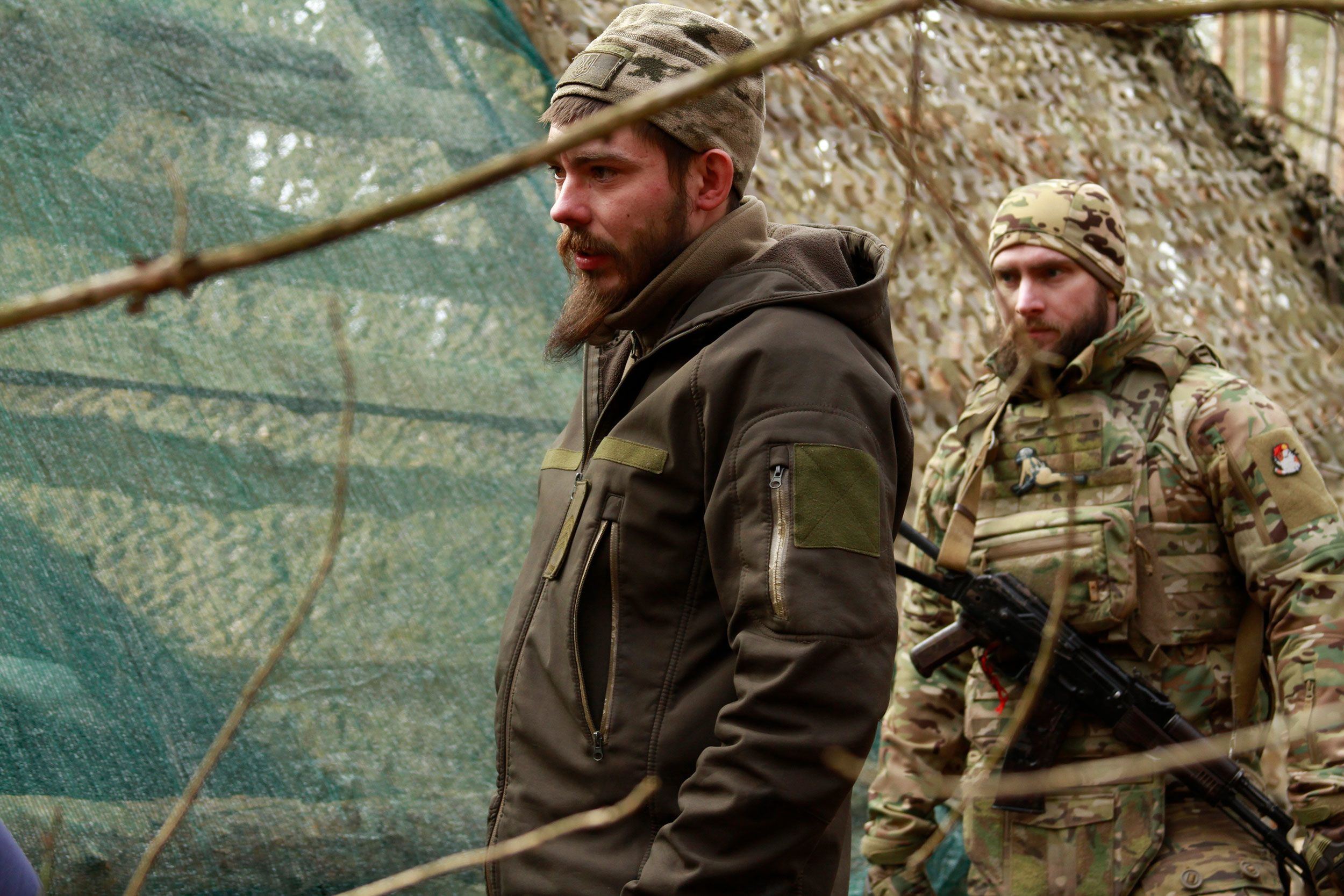 Gunner Artem, left, and his troop commander Oleh Bulatetskyi are pictured in eastern Ukraine.