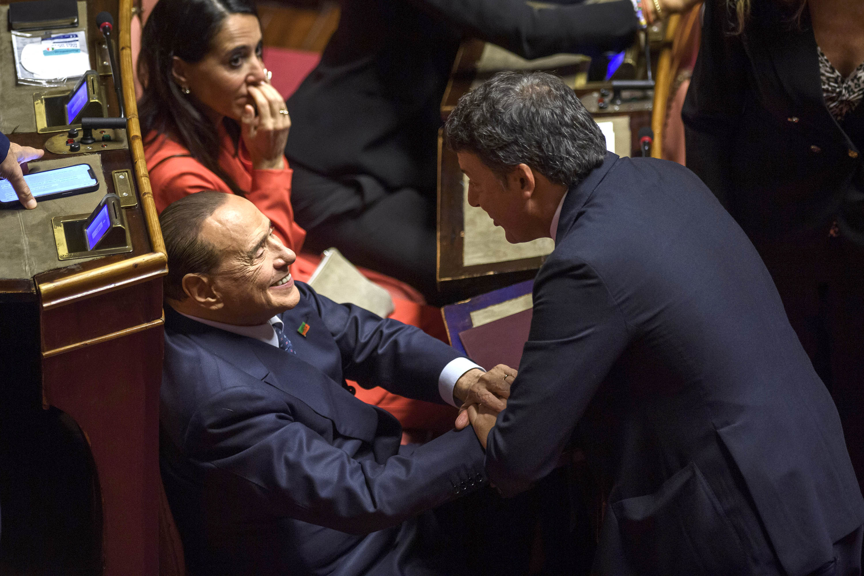 Silvio Berlusconi greets Matteo Renzi during a legislative session at the Senate in Rome, Italy, in October 2022. 