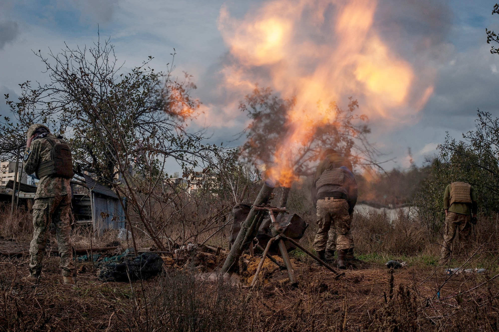 Ukrainian servicemen fire a mortar on a front line near Bakhmut, Donetsk region, Ukraine, on November 6, 2022. 