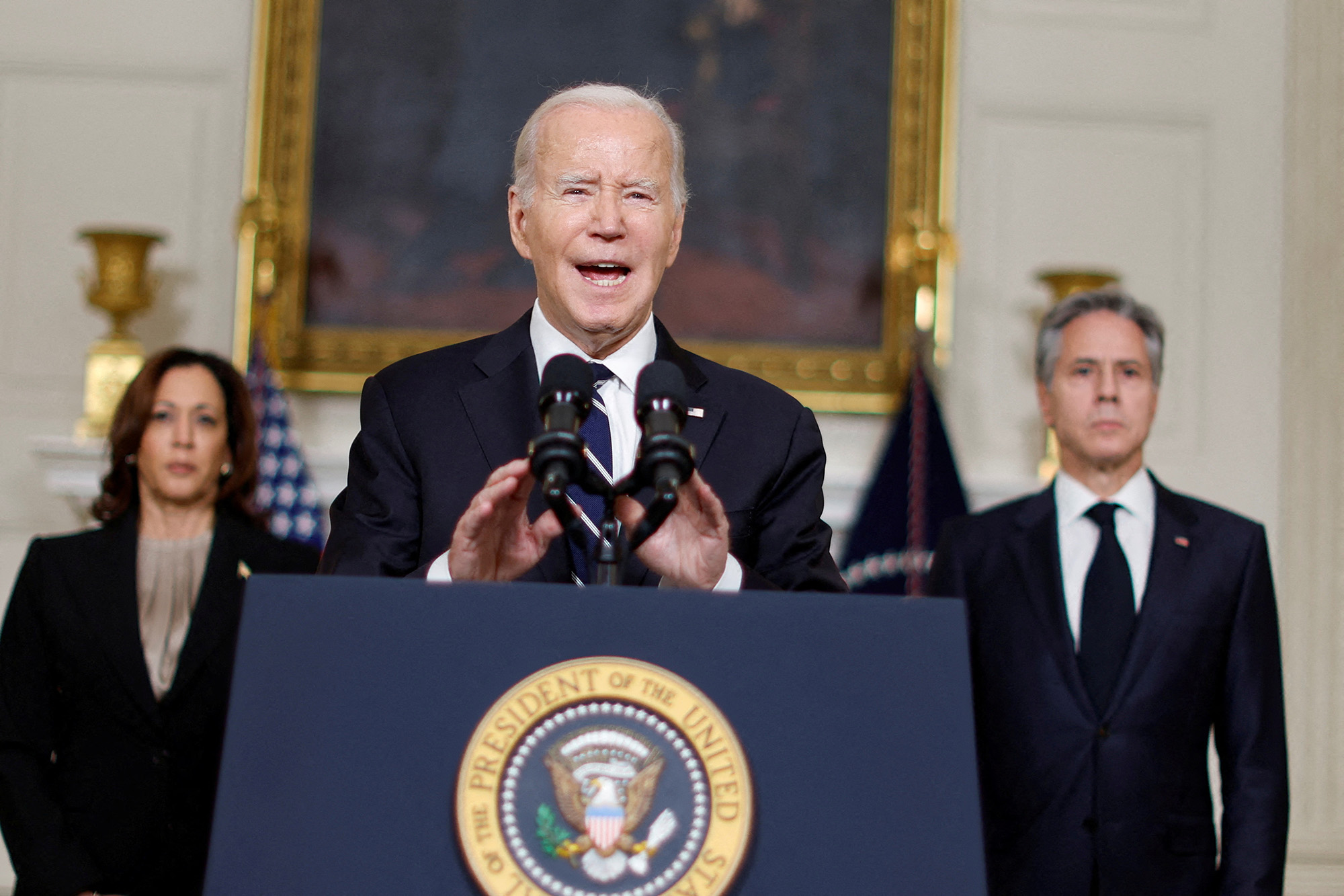 U.S. President Joe Biden, center, accompanied by Vice President Kamala Harris, left, and Secretary of State Antony Blinken, makes remarks after speaking by phone with Israeli Prime Minister Benjamin Netanyahu from the State Dining Room at the White House in Washington, DC, on October 10.