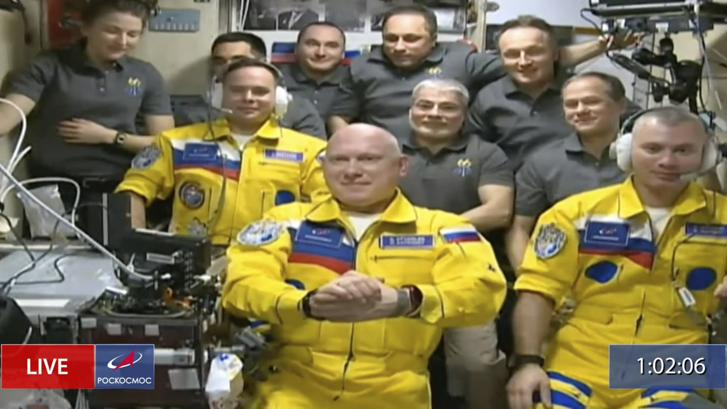 In this frame grab from video provided by Roscosmos, Russian cosmonauts Sergey Korsakov, Oleg Artemyev and Denis Matveyev are seen during a welcome ceremony after arriving at the International Space Station, on March 18, the first new faces in space since the start of Russia’s war in Ukraine. The crew emerged from the Soyuz capsule wearing yellow flight suits with blue stripes, the colors of the Ukrainian flag.