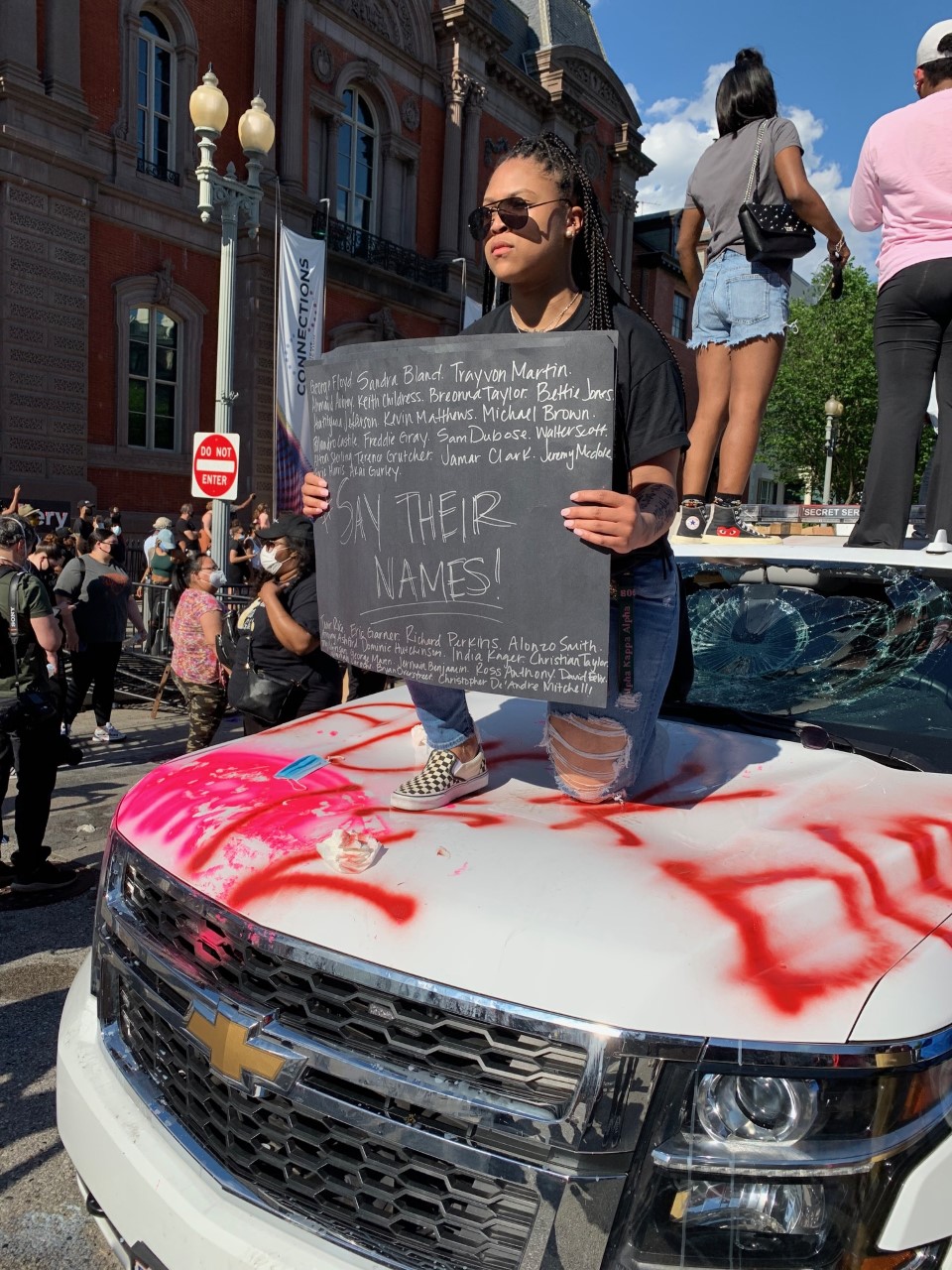 Protesters stand on top of a Secret Service vehicle outside of the White House on May 30, 2020.