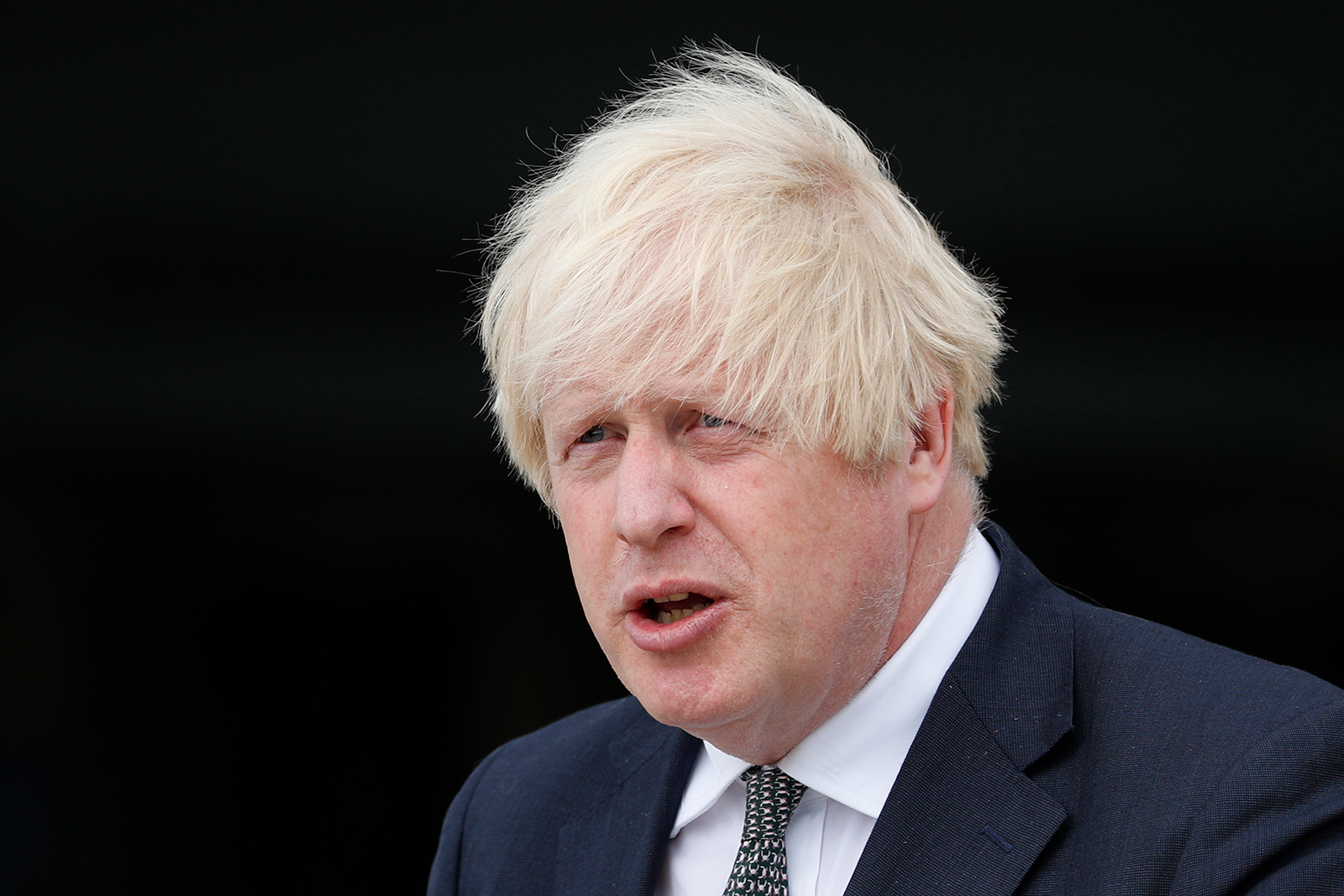 Britain's Prime Minister Boris Johnson leaves following a visit at Northwood Headquarters, the British Armed Forces Permanent Joint Headquarters on August 26.
