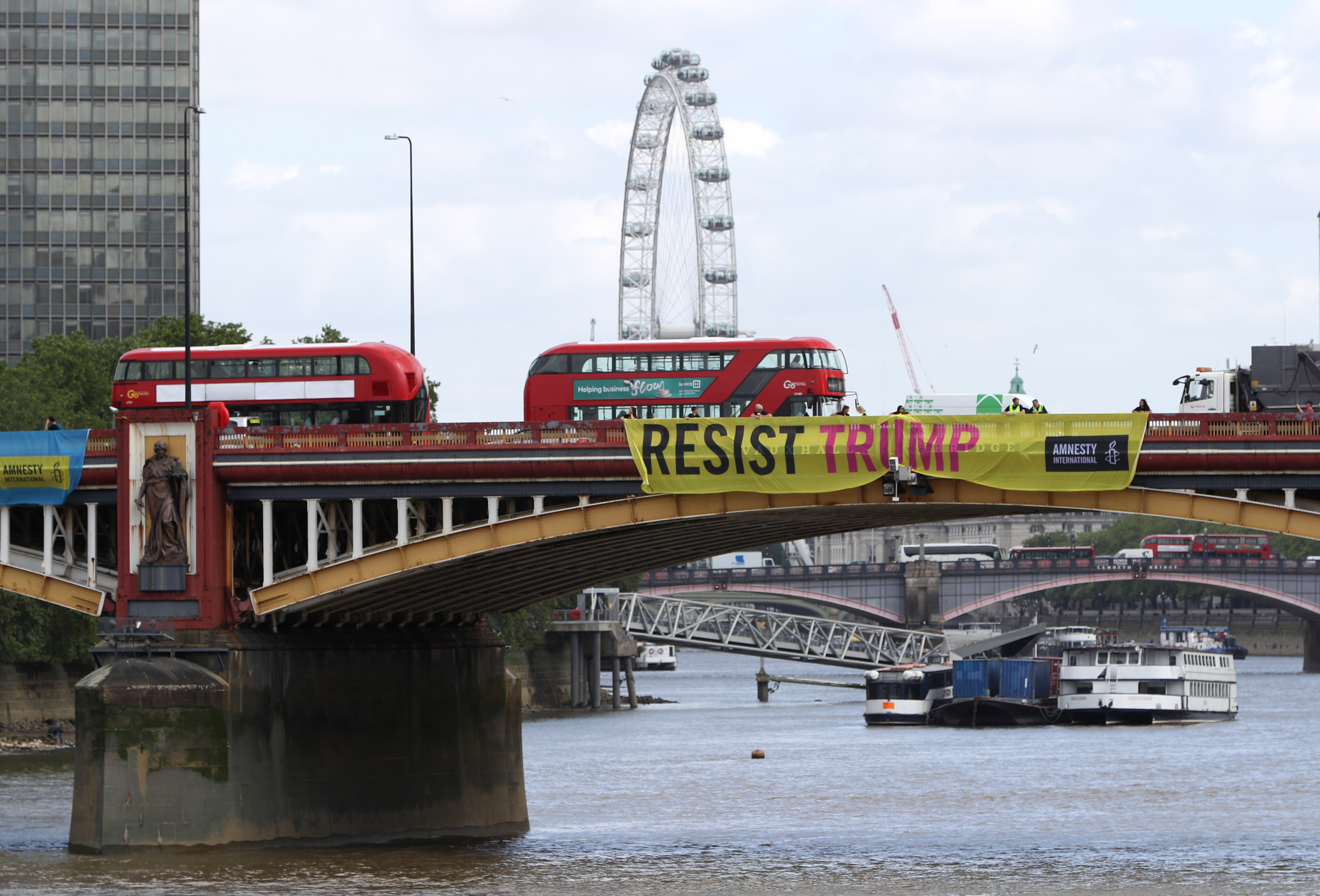 A banner unveiled on Vauxhall Bridge in London on Monday.