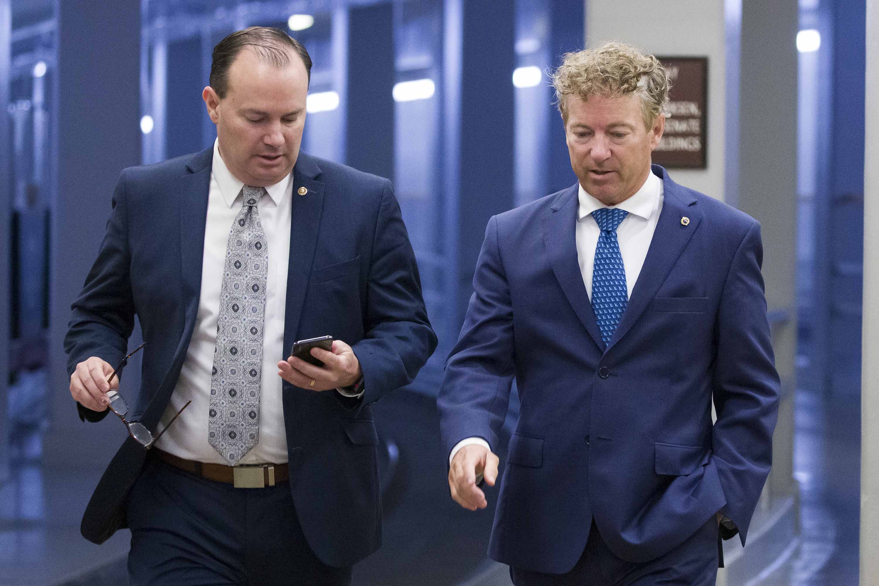 Senators Mike Lee and Rand Paul walk to a vote on Capitol Hill in June 2019.