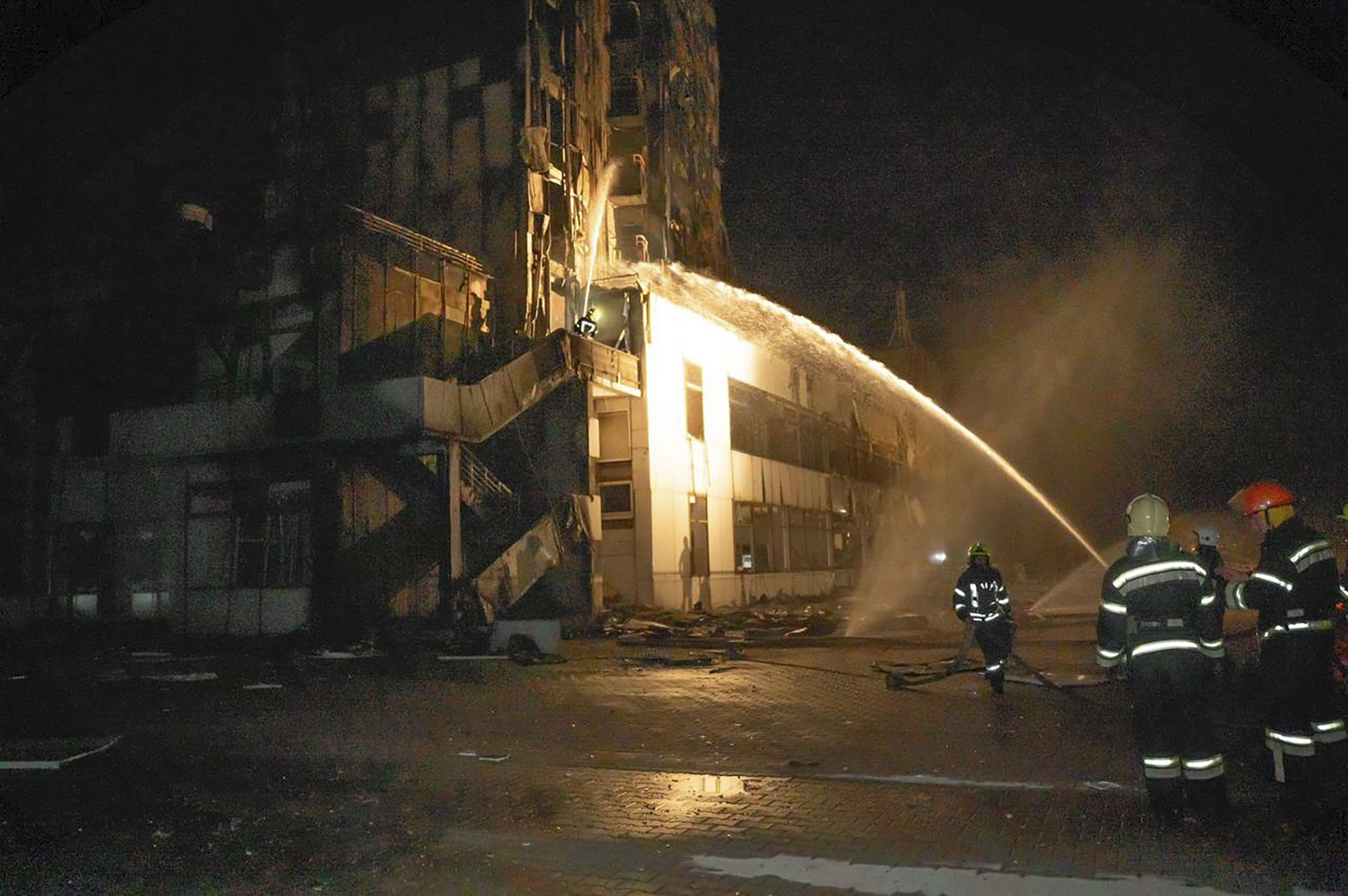 Firefighters work to extinguish a fire in a hotel at the seaport after a Russian rocket attack in Odesa, Ukraine, on September 25.