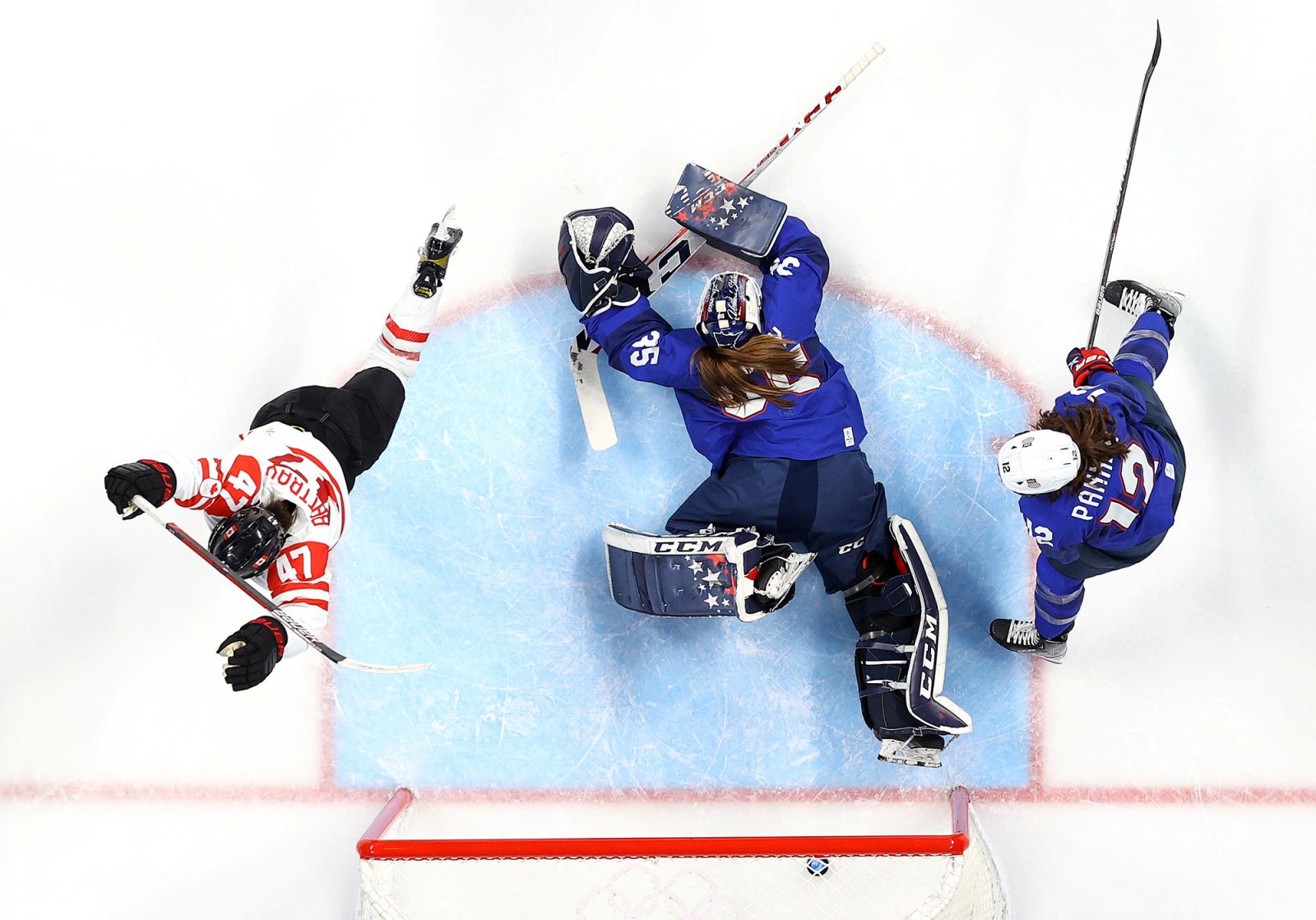 Canada's Jamie Lee Rattray, left, reacts after scoring a goal against the United States during a preliminary round game on February 8. Canada won 4-2. The two teams have played in the gold-medal game in the past three Olympics.