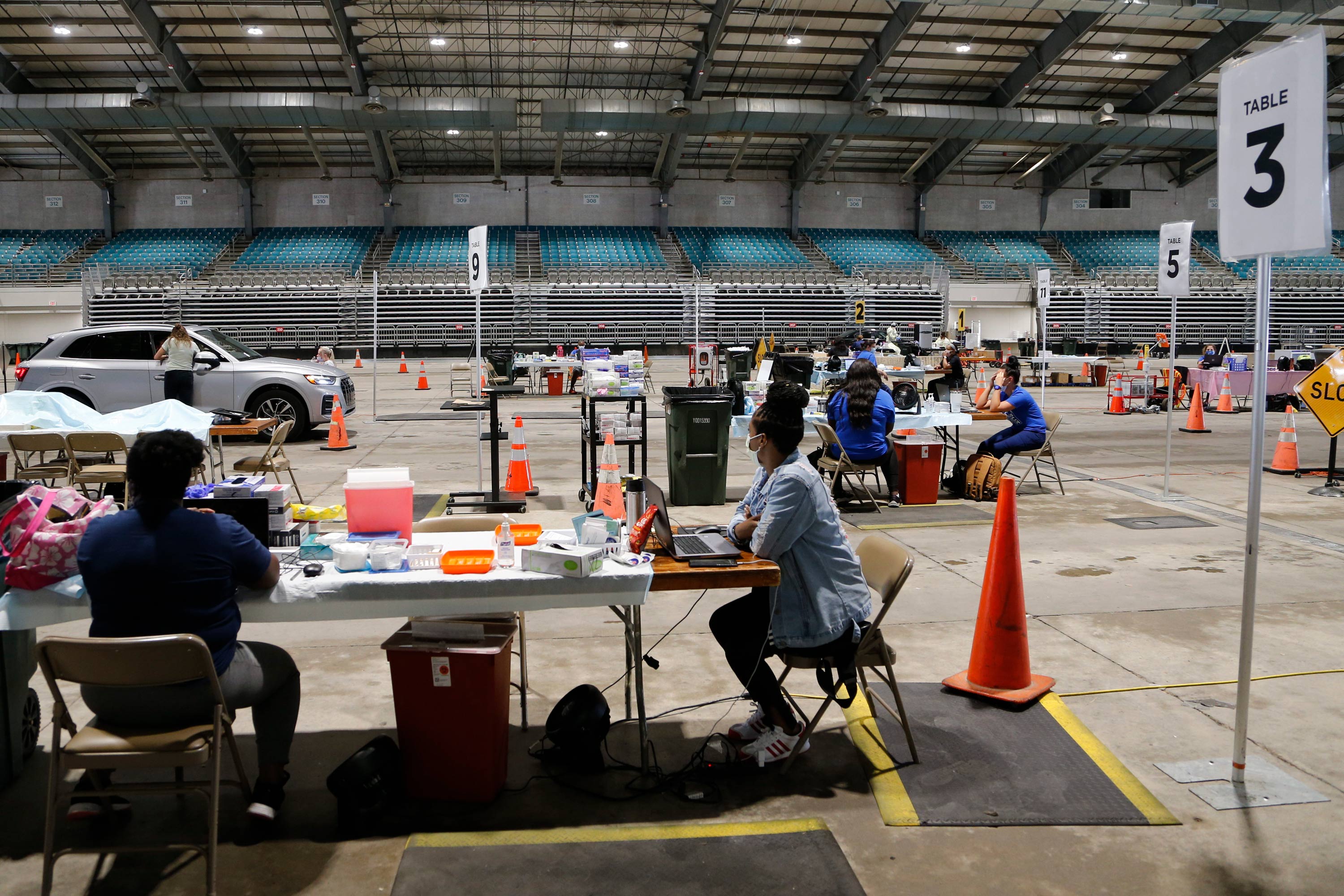 Health care workers provide vaccinations at a drive-thru clinic on June 10 in Columbus, Ohio. 