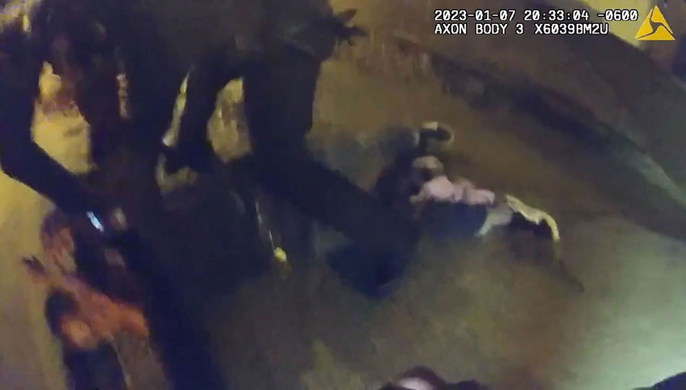 In this still from video released by the City of Memphis, officers from the Memphis Police Department beat Tyre Nichols on a street corner.