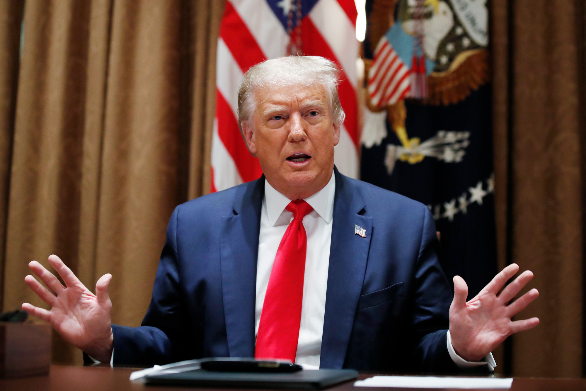 President Donald Trump speaks during a meeting before signing an Executive Order on hiring American workers, in the Cabinet Room of the White House on Aug. 3 in Washington, DC.