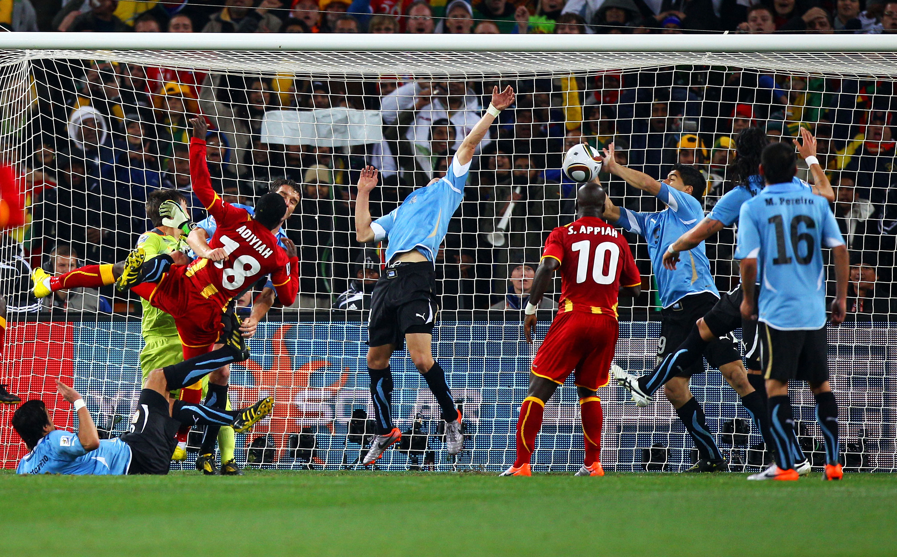 Luis Suarez of Uruguay handles the ball on the goal line during the 2010 World Cup match between Uruguay and Ghana.