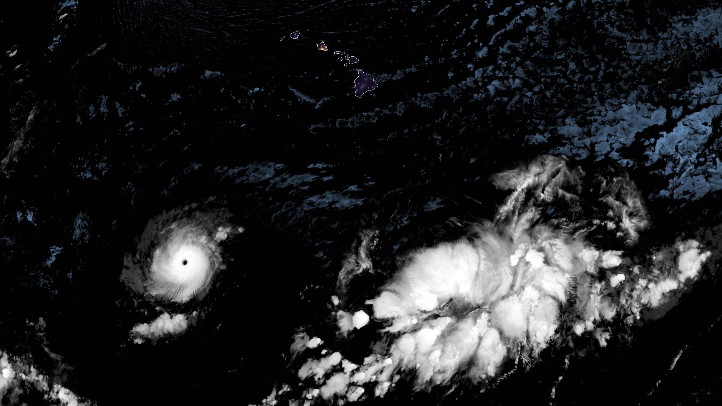 Hurricane Dora is seen moving across the Pacific Ocean with Hawaii to its north in this satellite image taken in the early hours of Wednesday.